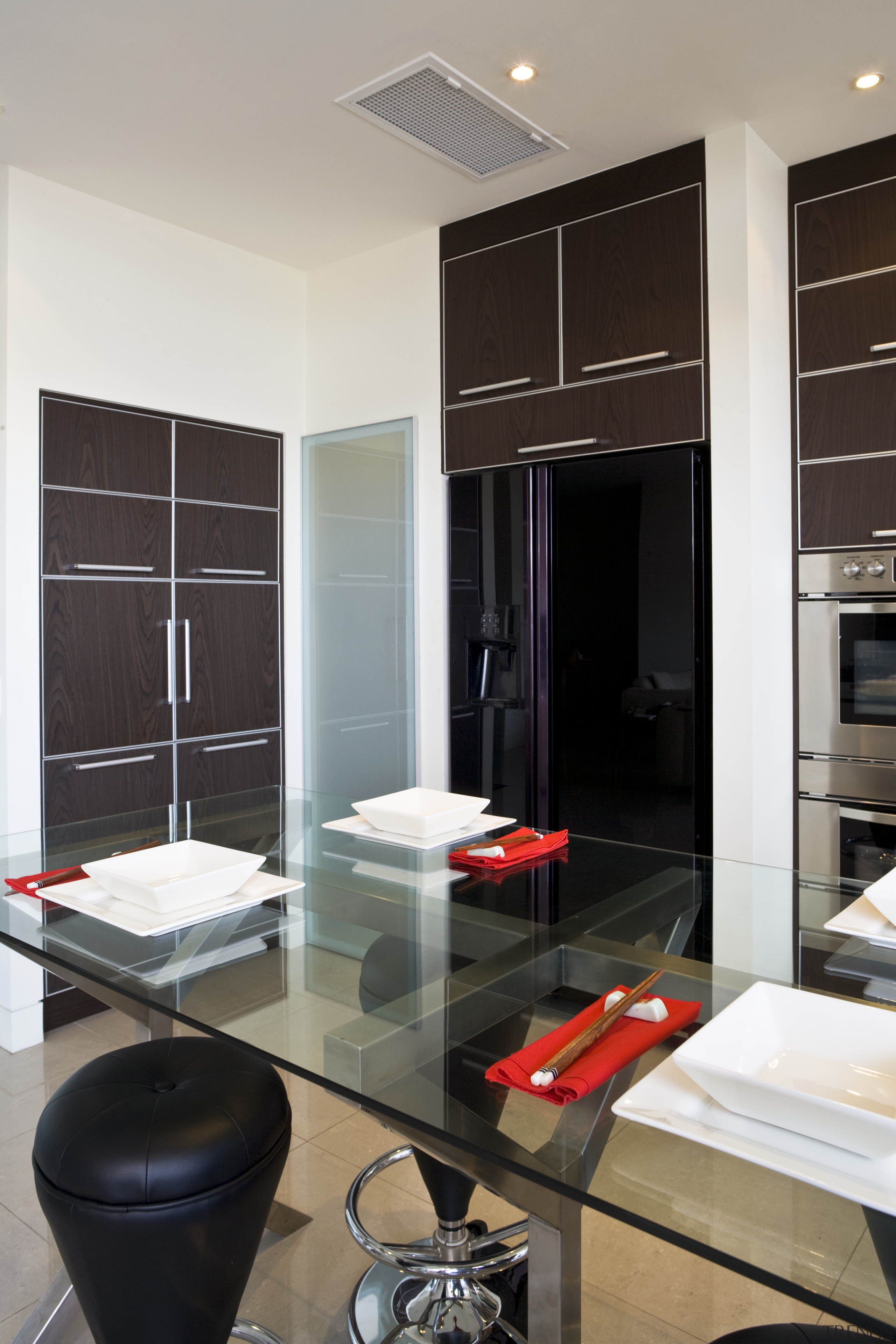 View of a custom-designed kitchen which features a cabinetry, floor, flooring, furniture, interior design, living room, room, gray, black