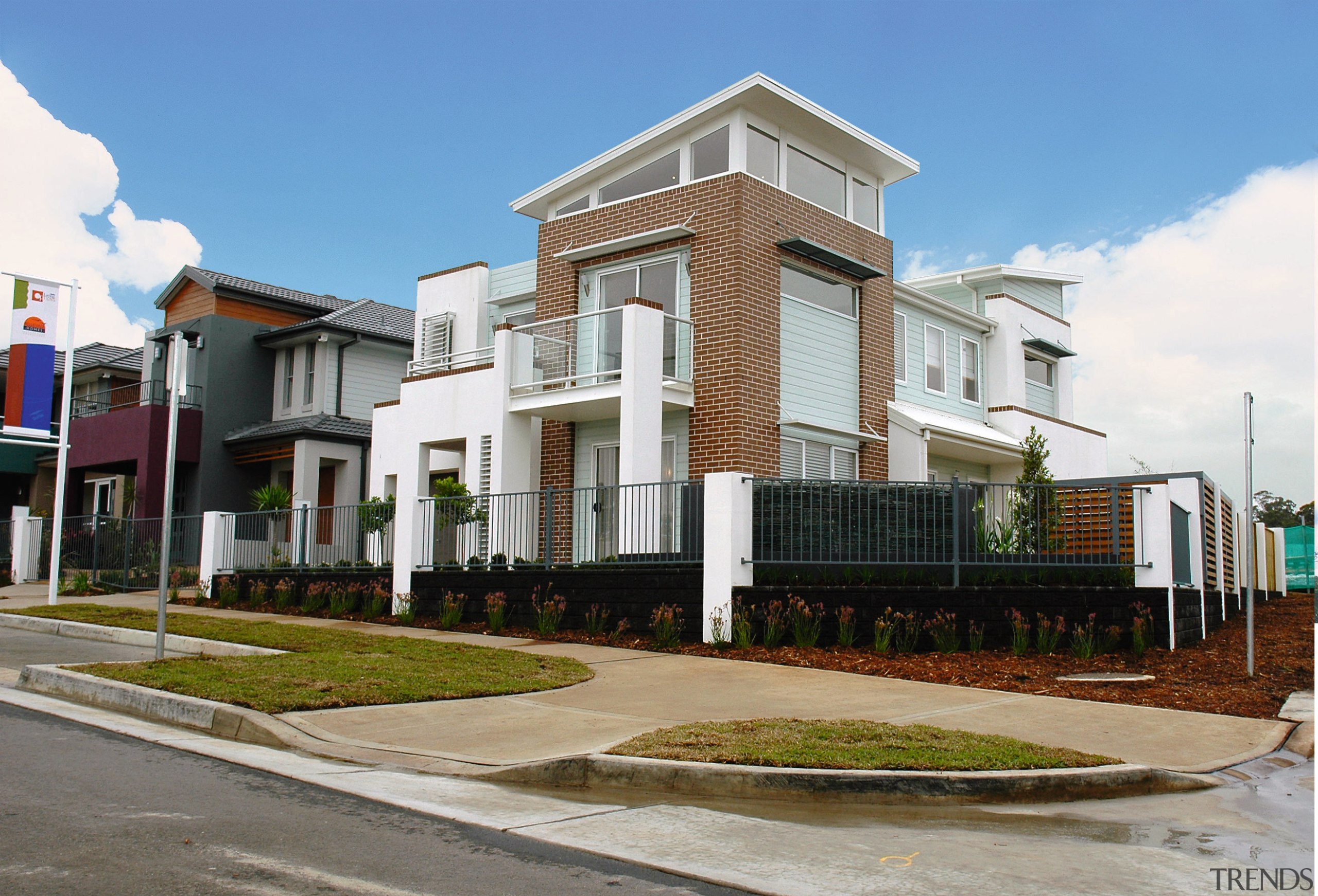 Two storey home on street corner with brown apartment, building, condominium, elevation, estate, facade, home, house, mixed use, neighbourhood, property, real estate, residential area, suburb