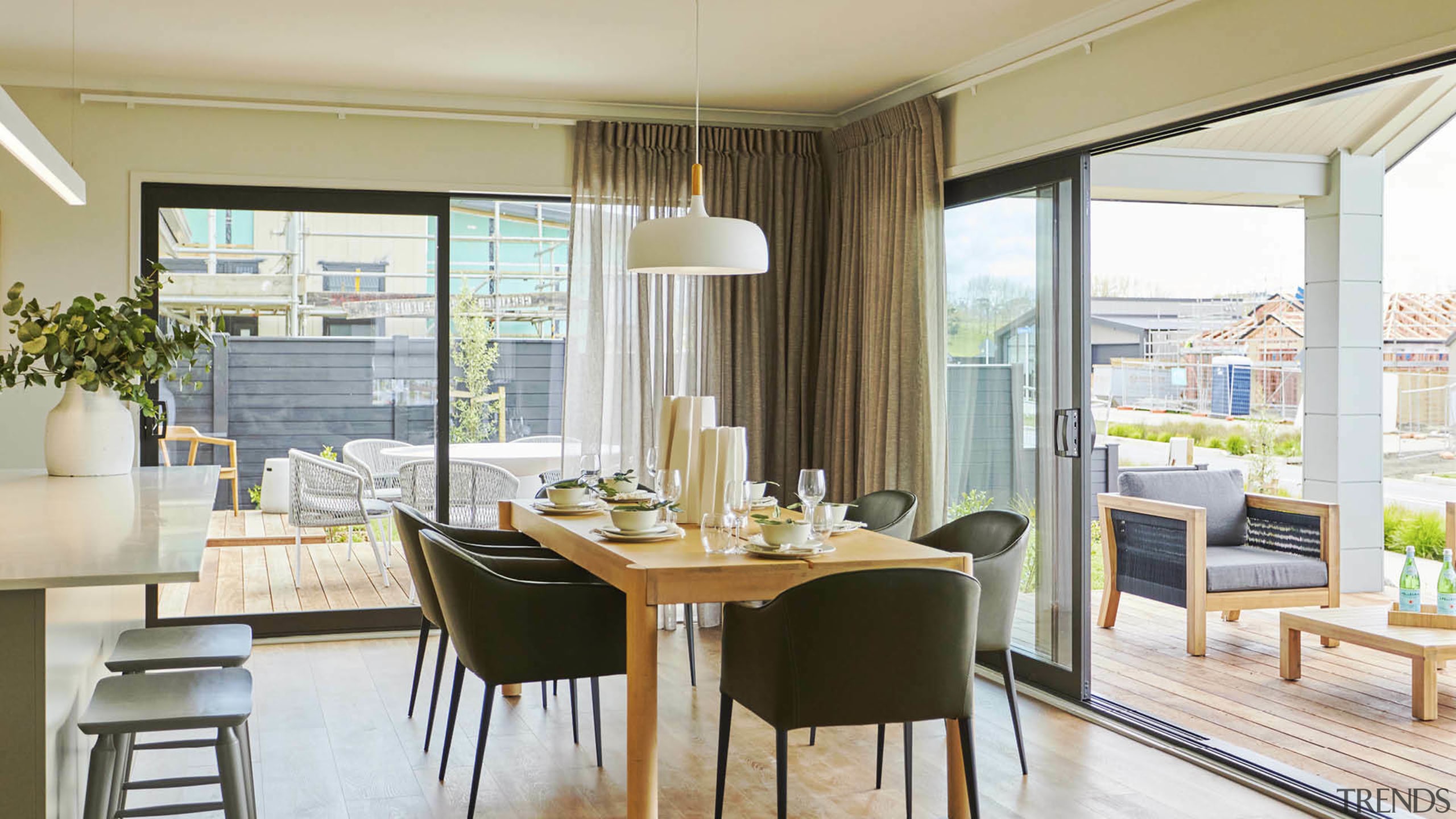 Walls of windows ensure the generous entertainment living/dining/kitchen 