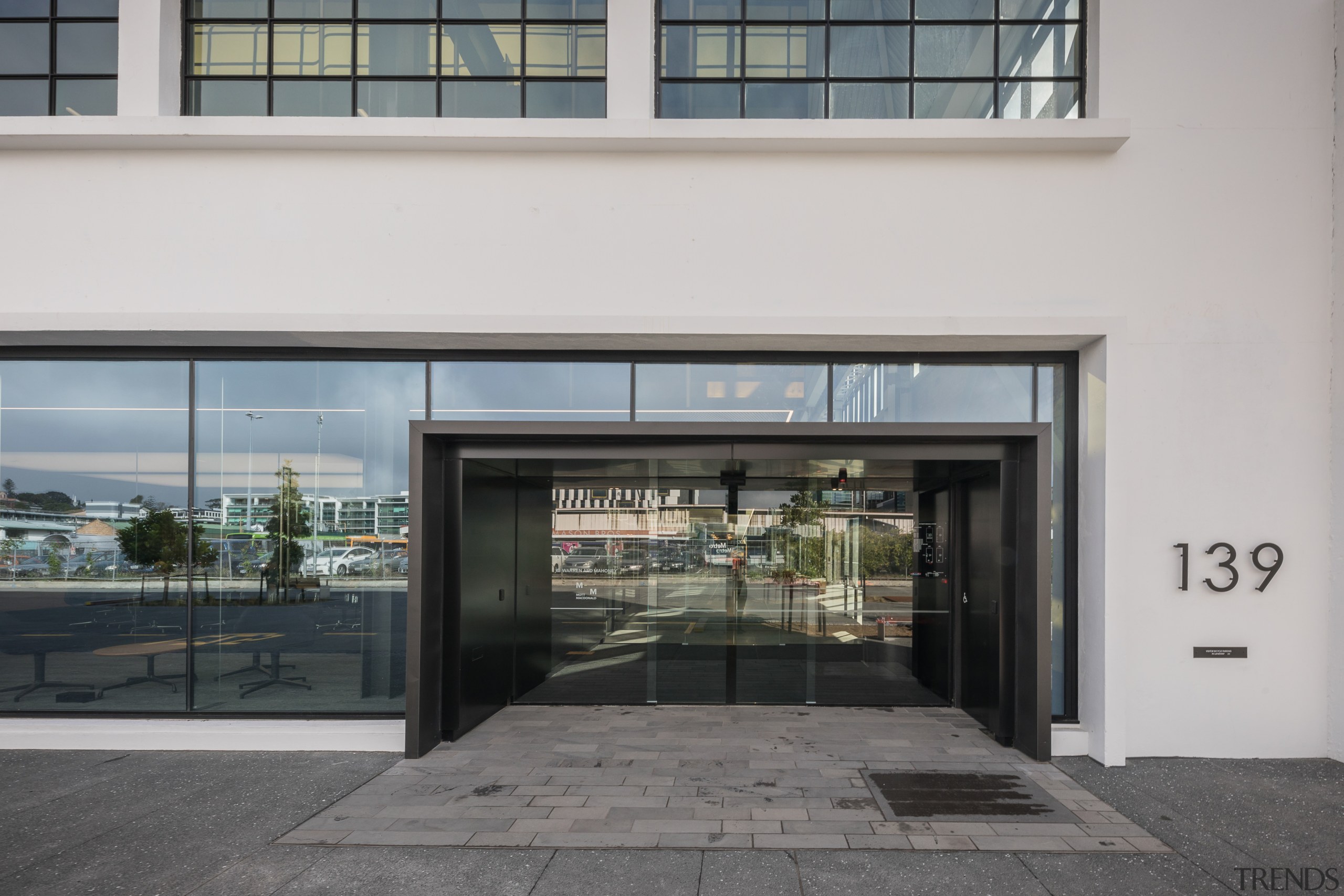 The front entry to architects Warren and Mahoneys building, door, facade, gray