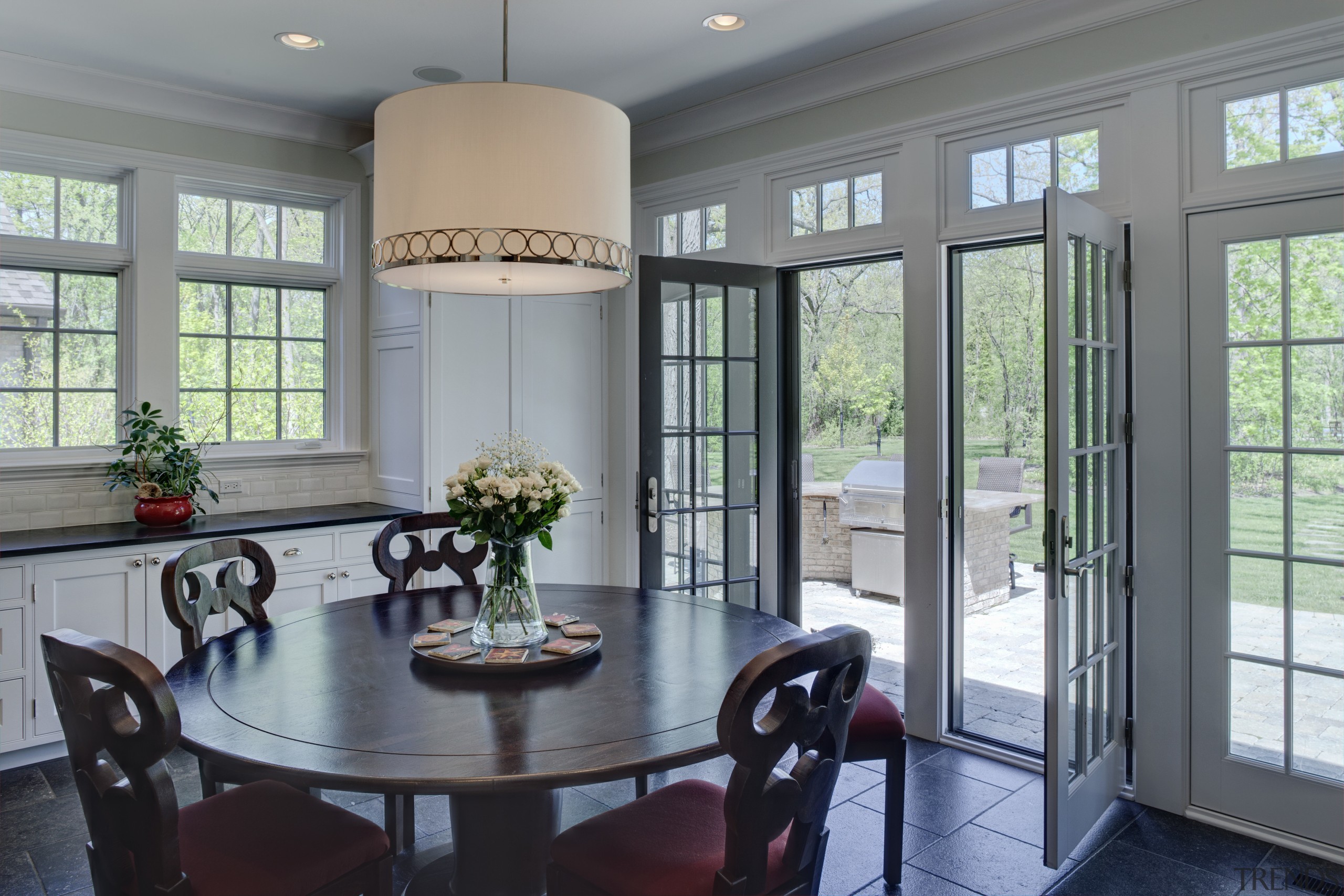 Arched openings. Red splash back. Limestone floors. White dining room, door, home, interior design, real estate, room, window, gray