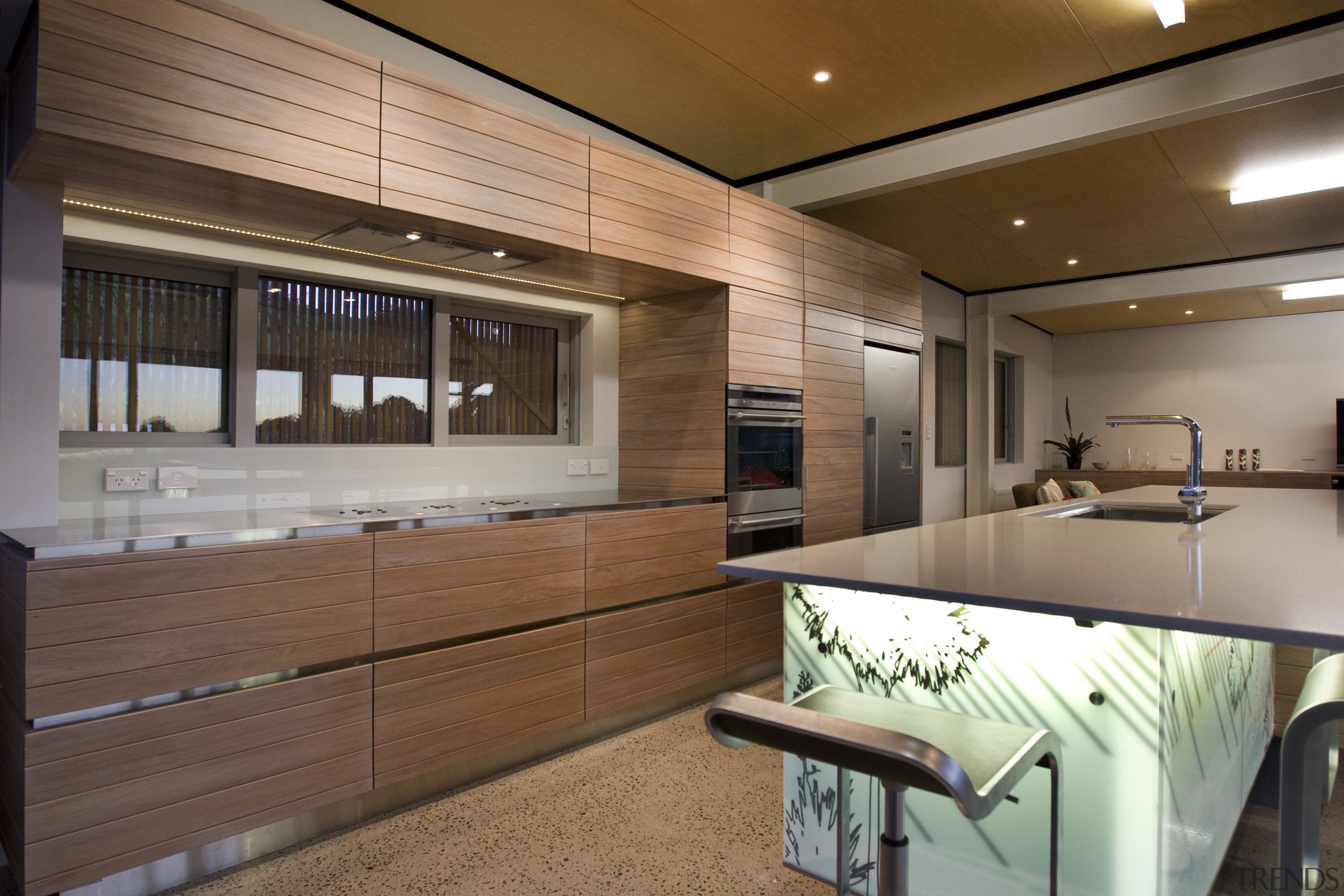 View of a kitchen which features an island interior design, kitchen, real estate, wood, brown