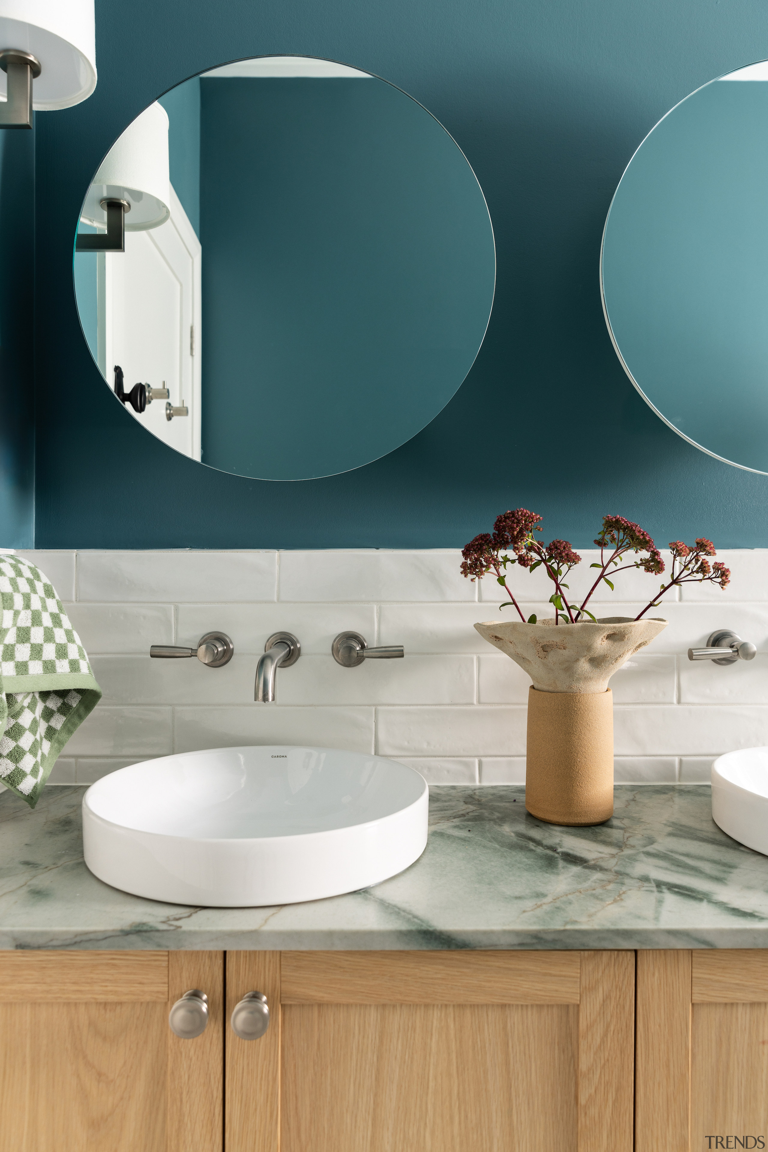 Vanity mirrors add to the sense of space. 