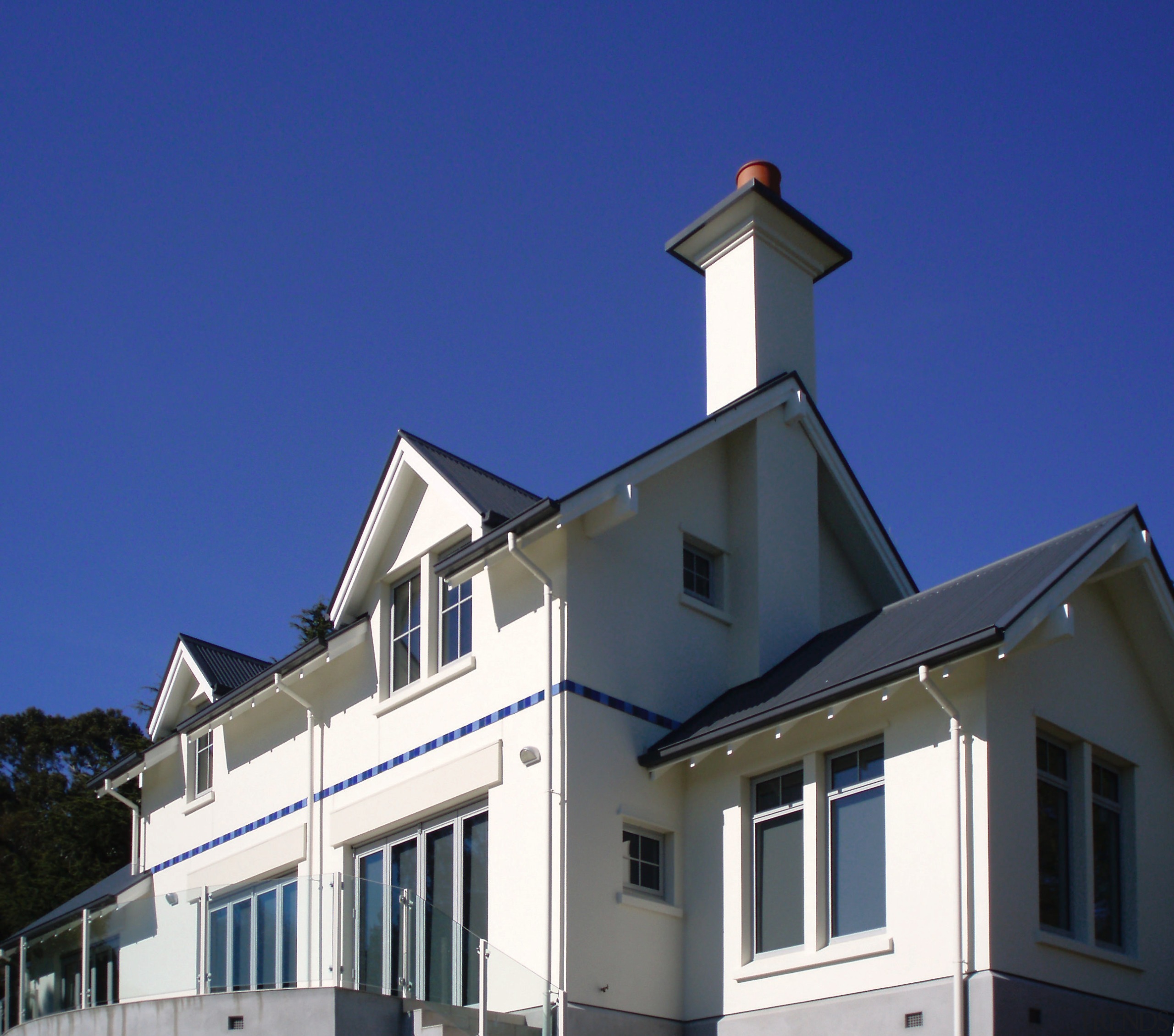 MJ Reid Plasters, Christchurch, applied Rockcote's LiteRock Solid building, facade, home, house, property, real estate, roof, sky, window, blue