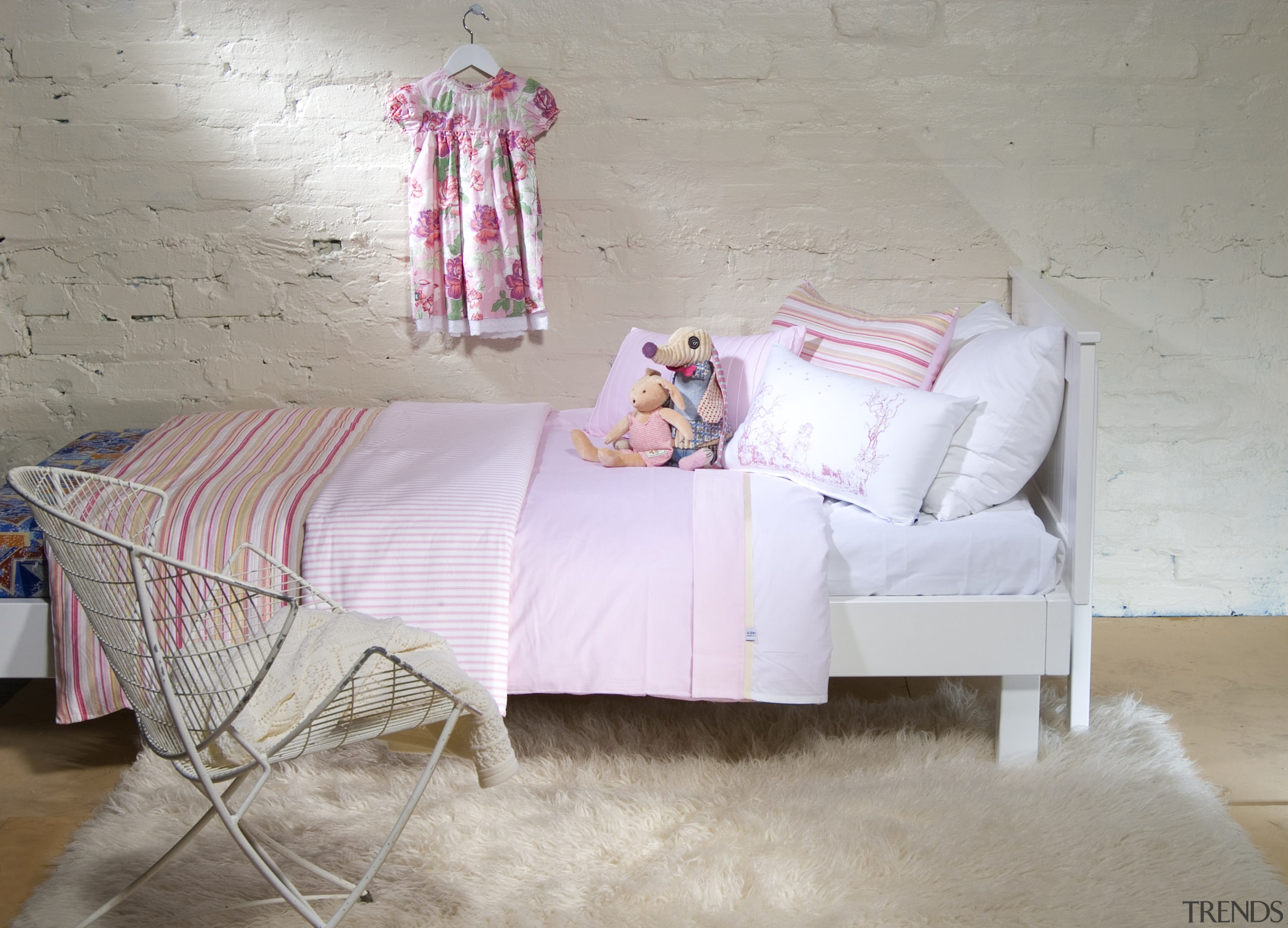 A view of these childrens Bedrooms featuring colourful bed, bed frame, bed sheet, bedding, bedroom, chair, couch, cushion, duvet cover, floor, furniture, interior design, linens, mattress, pink, product, room, textile, wall, gray