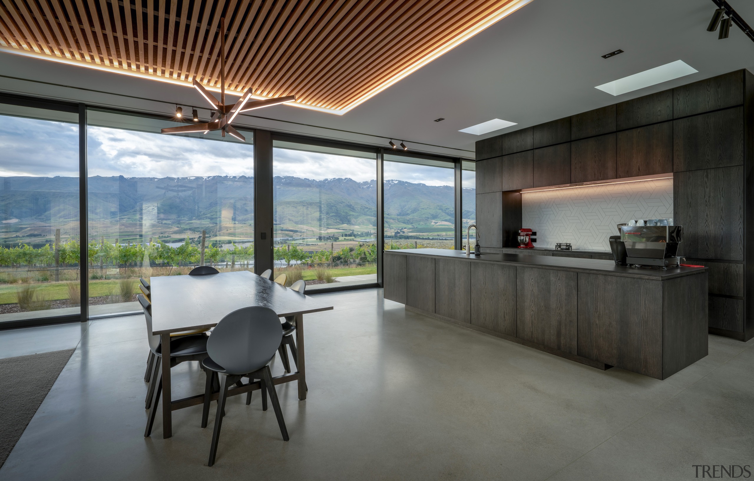 Kitchen, dining, and mountain range. - A strong 