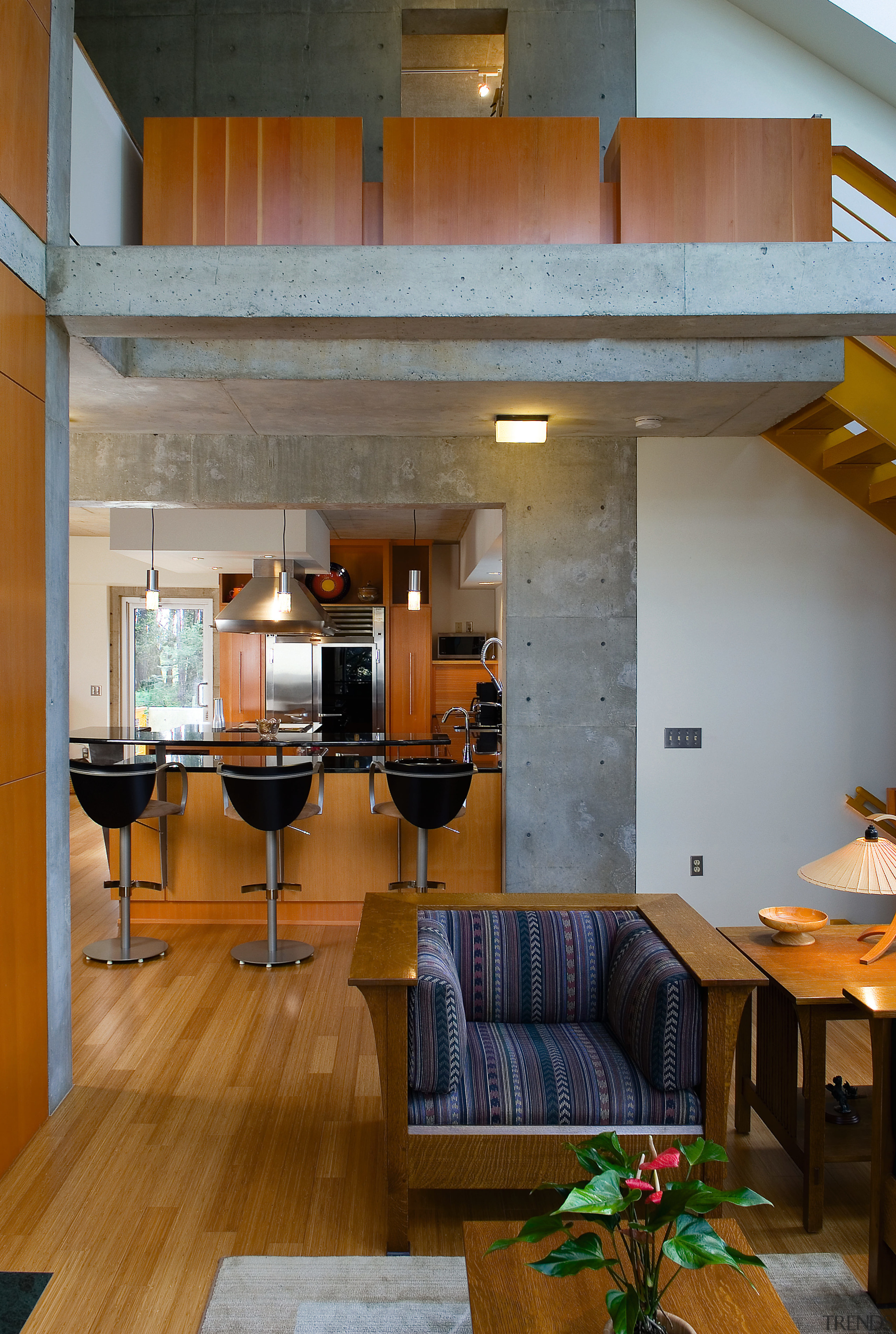 An interior view of the living area feautirng architecture, ceiling, house, interior design, living room, loft, room, wood, brown, gray