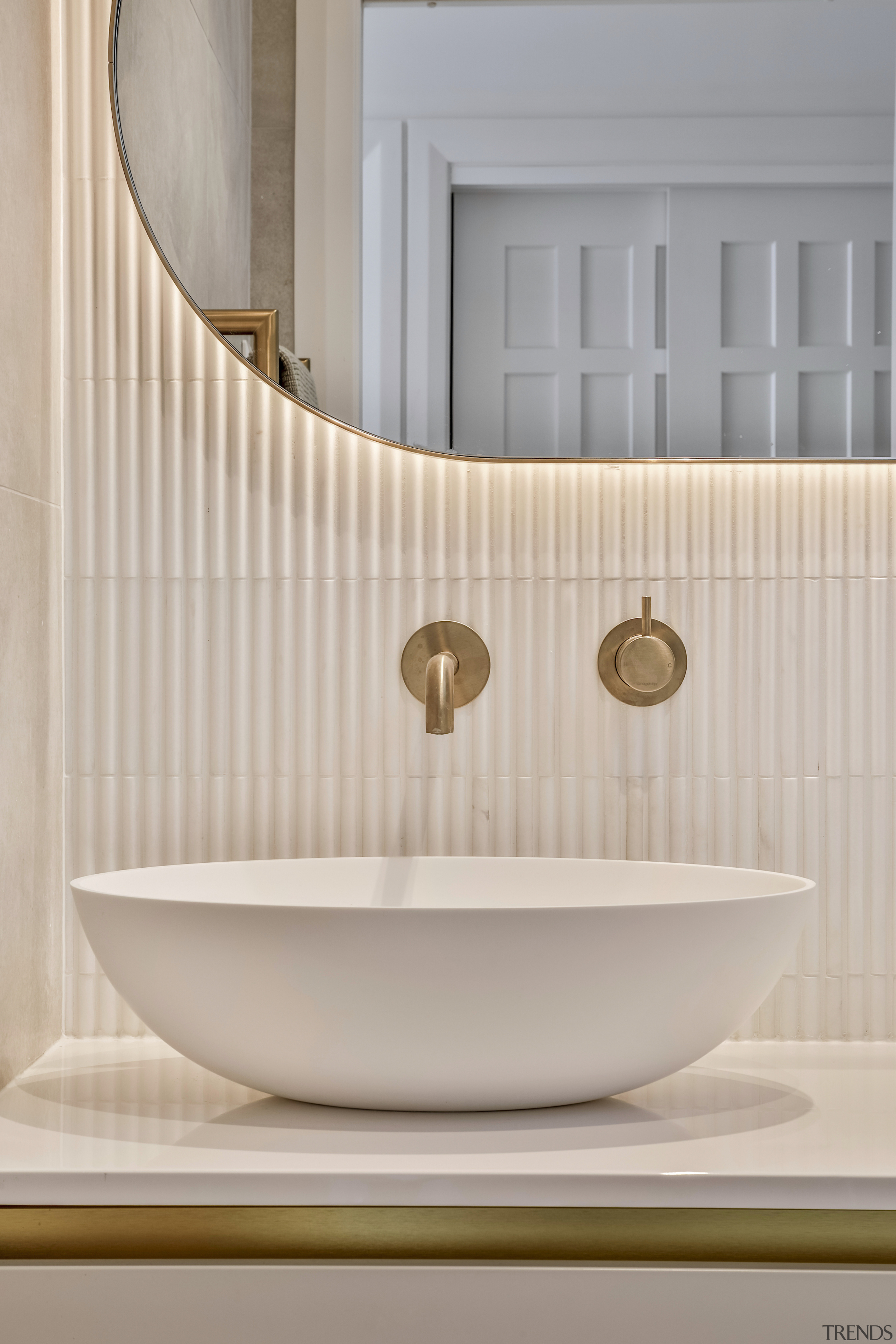 Fluted tiles adds an exotic vibe behind the 