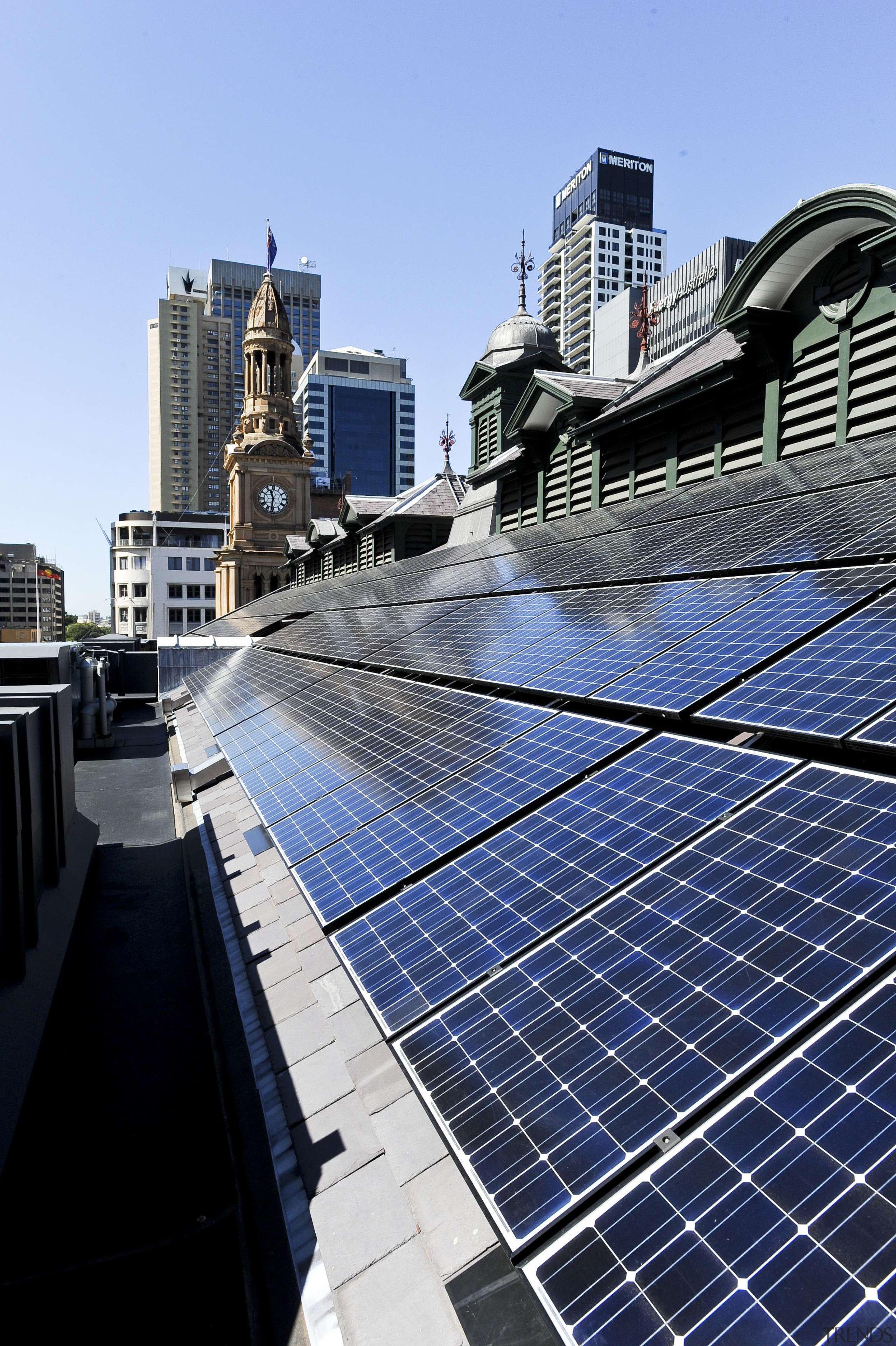 View of the renovated Sydney town hall featuring building, city, daytime, downtown, energy, metropolis, metropolitan area, roof, sky, skyscraper, urban area, water