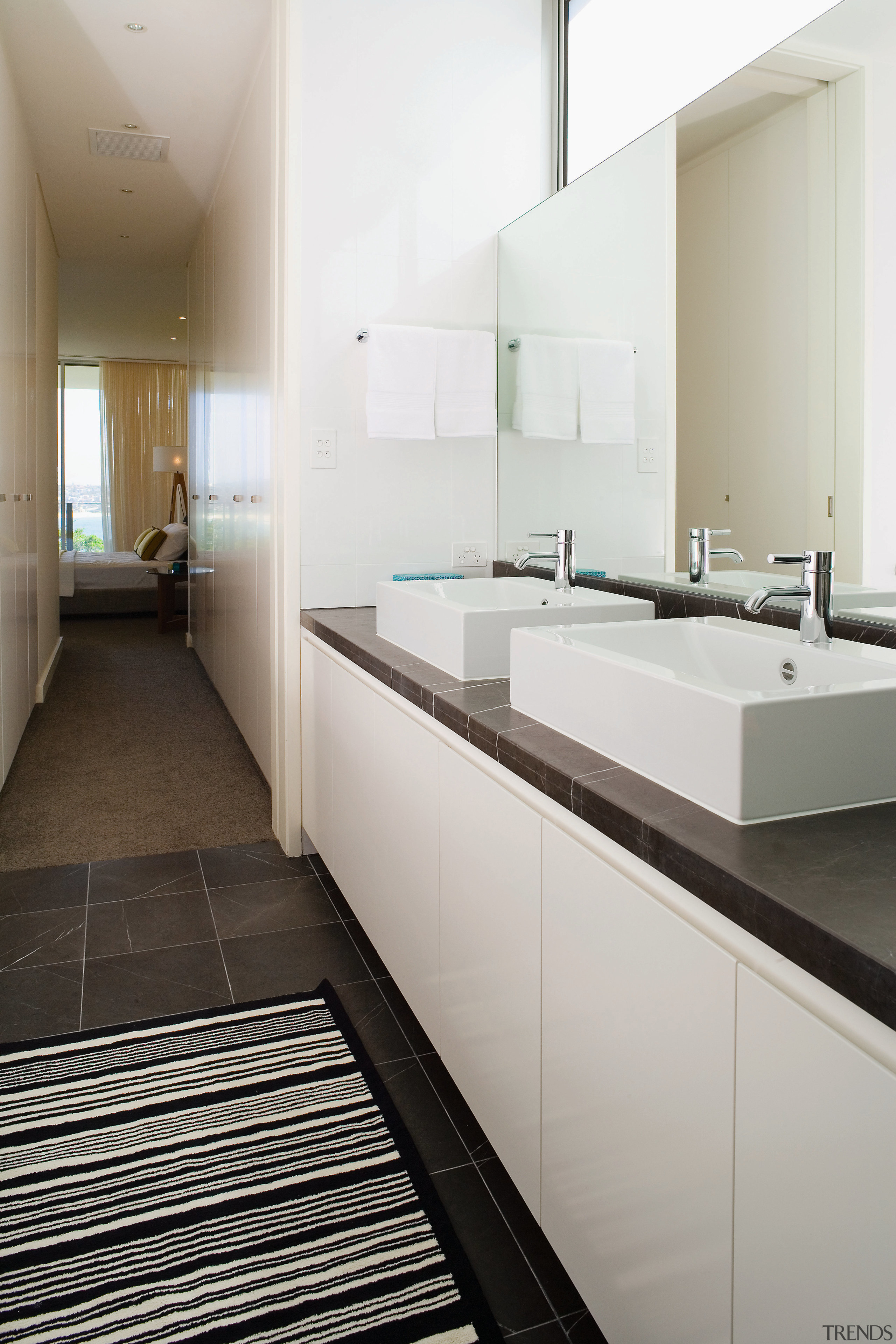 A view of some cabinetry by Trademark Kitchens. architecture, bathroom, countertop, floor, interior design, kitchen, room, sink, tile, gray