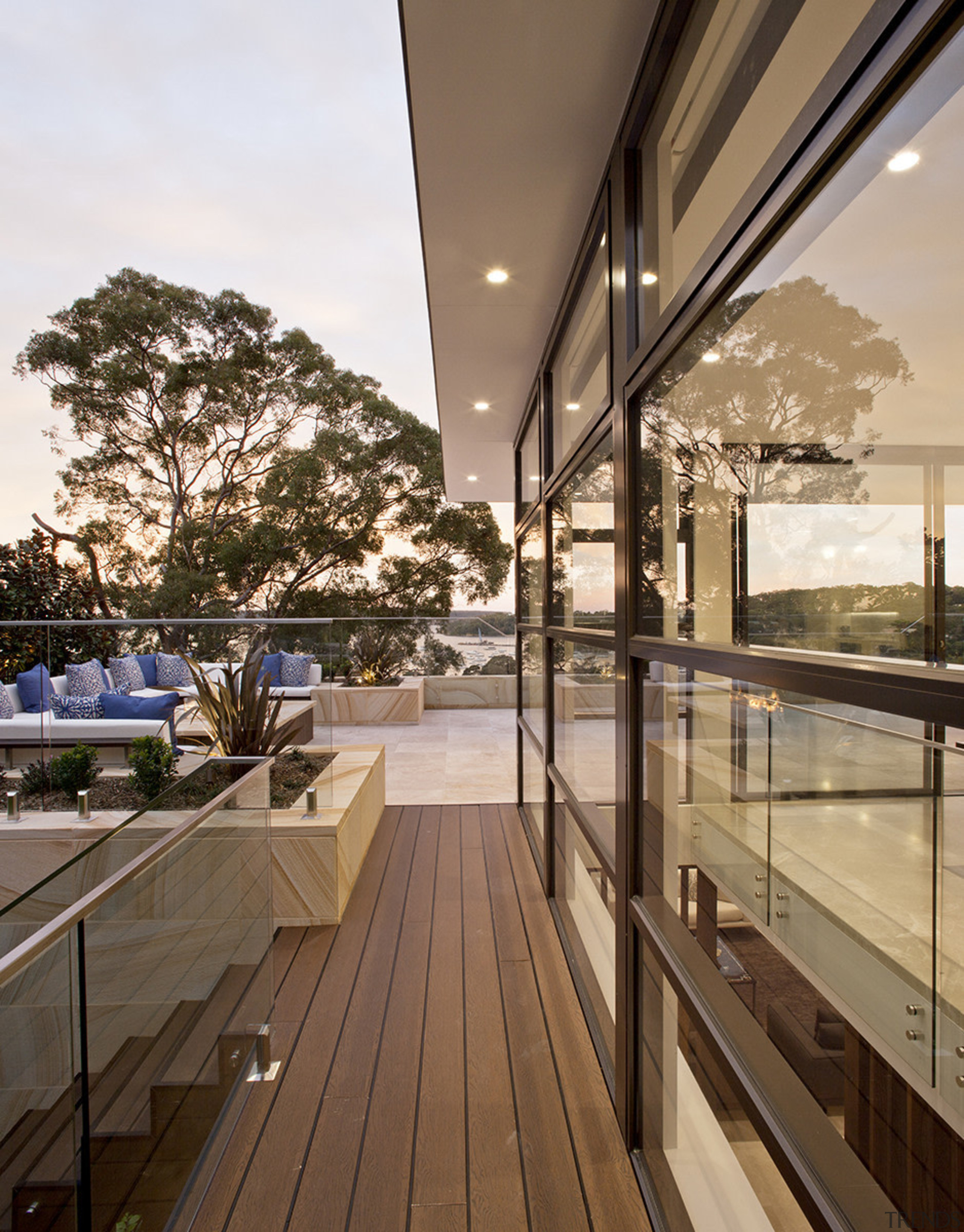 Sandstone featuring on the facade of this hillside apartment, architecture, balcony, condominium, daylighting, handrail, home, house, interior design, penthouse apartment, property, real estate, roof, window, brown