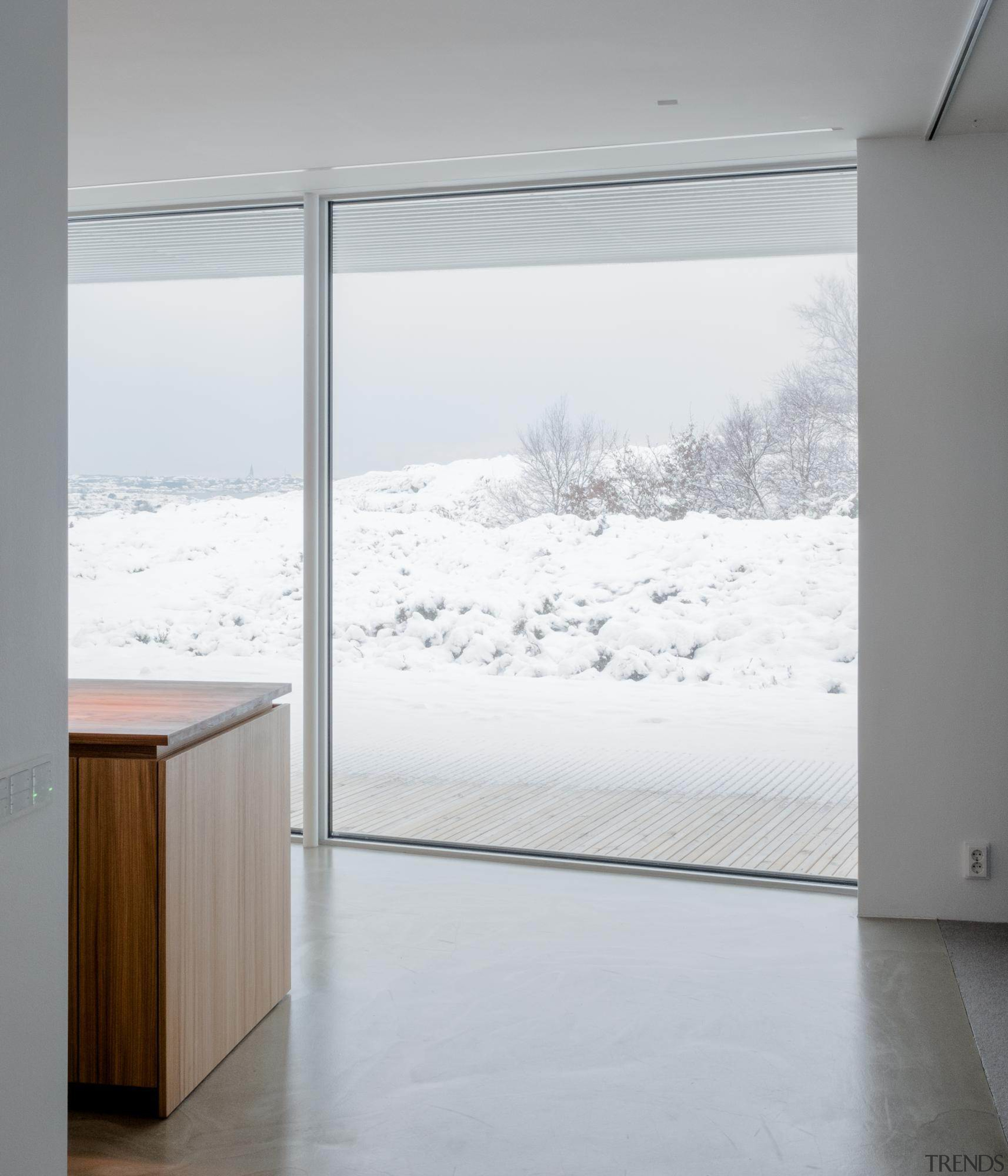 The home seems to hold the winter snow architecture, glass, home, house, interior design, window, white, gray