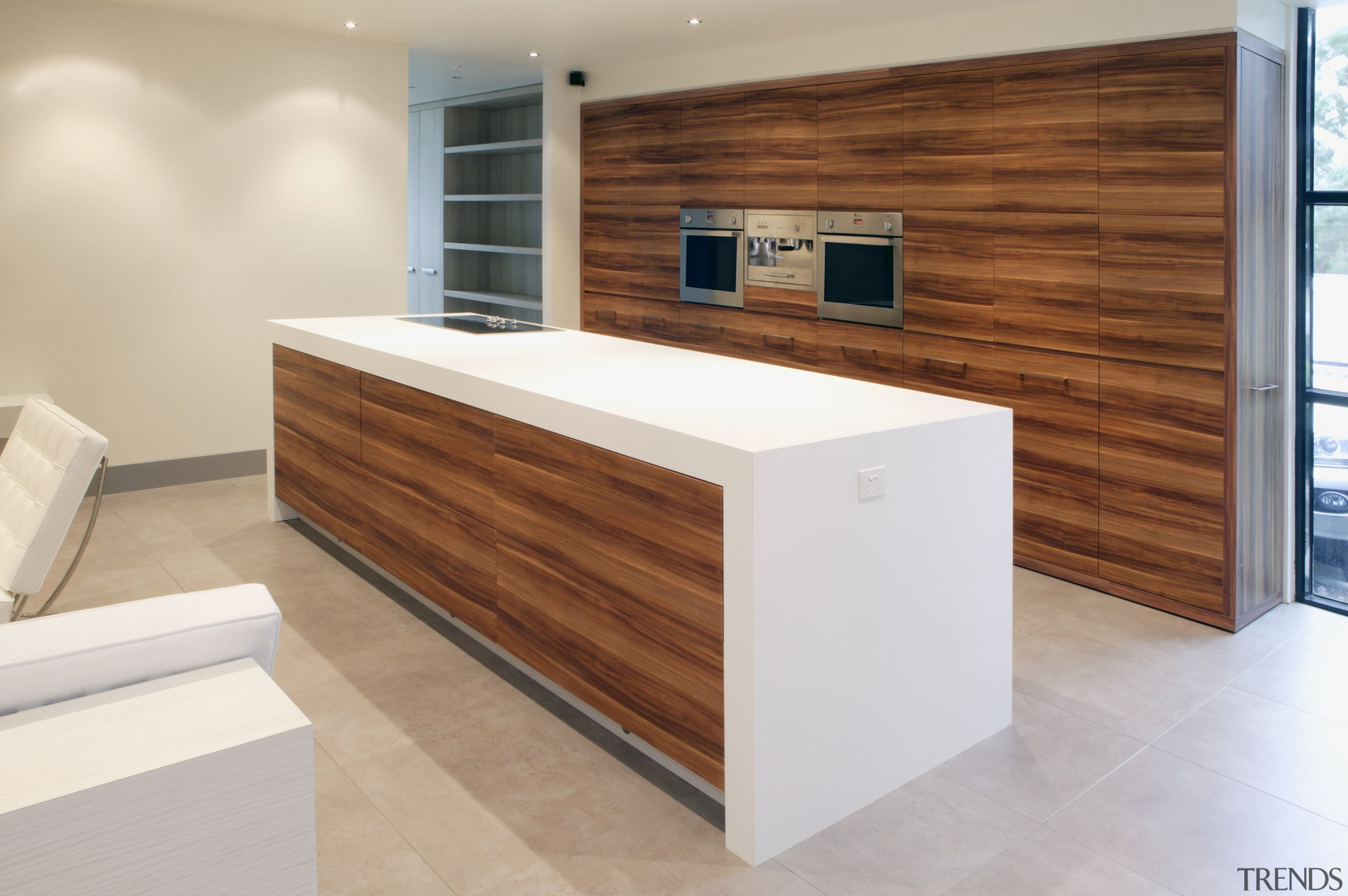 View of kitchen which features vinyl surfaces on cabinetry, countertop, floor, flooring, furniture, interior design, kitchen, product design, wood, gray, brown