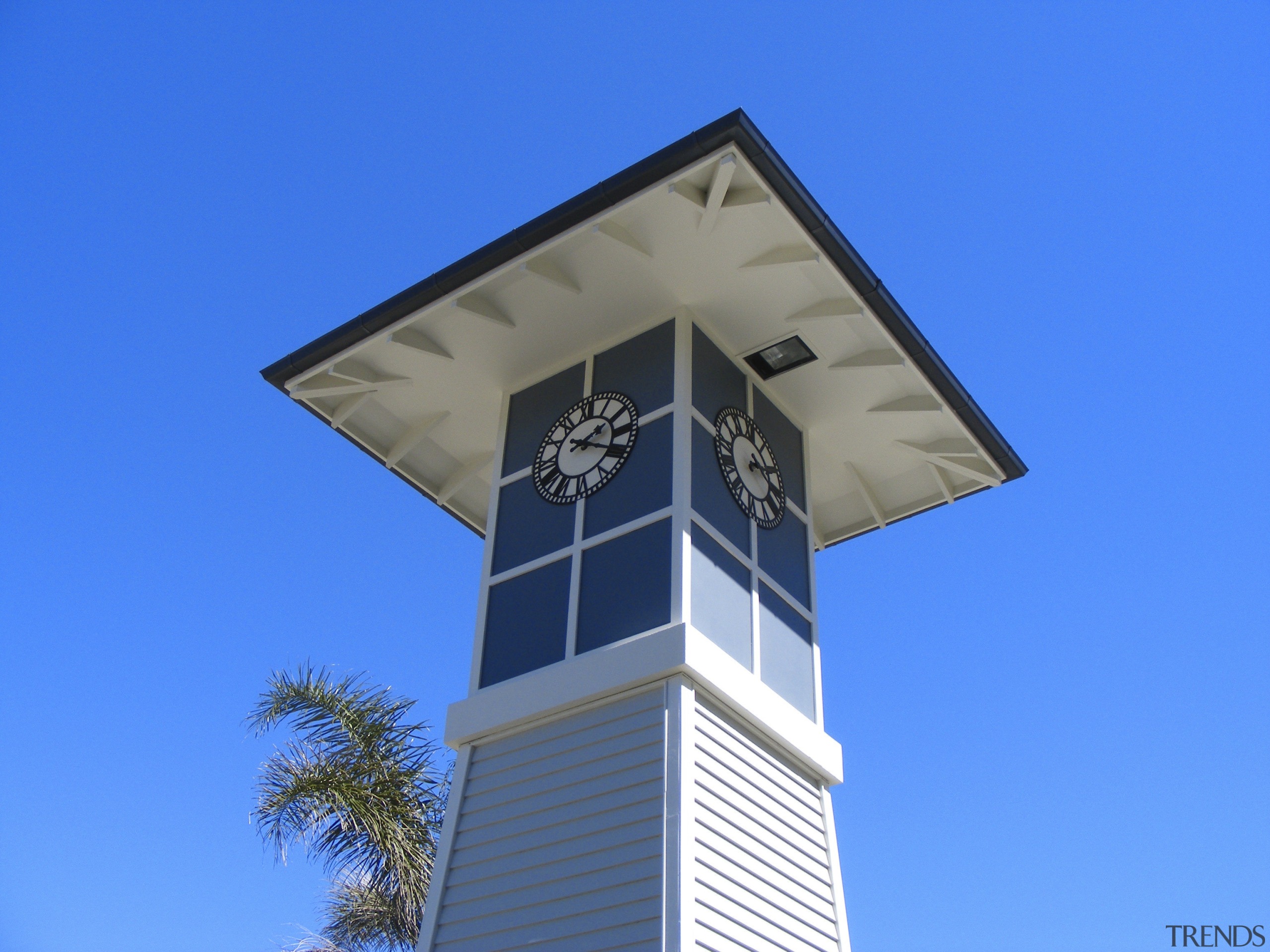 View of Kensington park's clock tower at the building, facade, landmark, sky, tower, blue