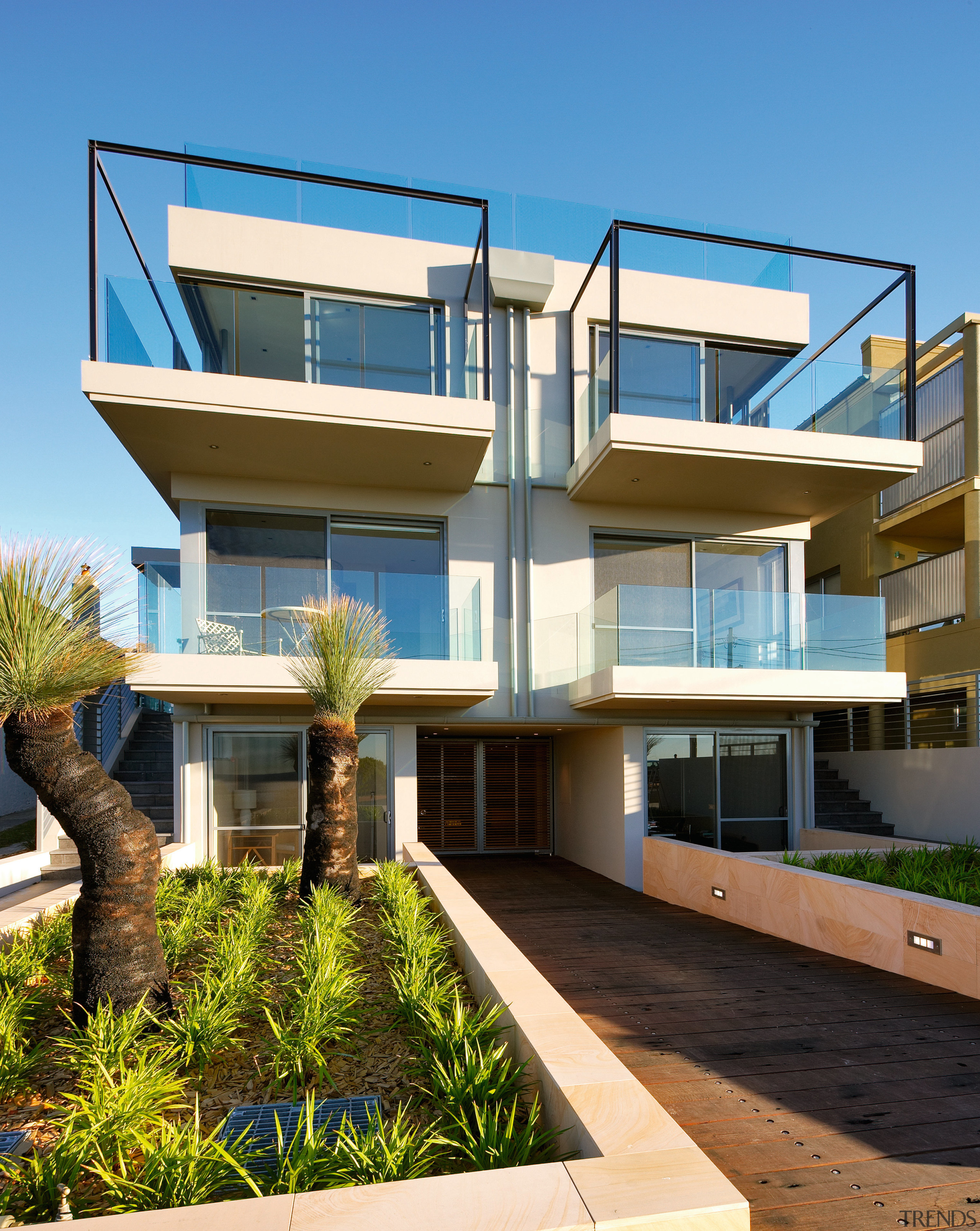 This new four-storey home overlooking Maroubra beach has apartment, architecture, building, condominium, elevation, estate, facade, home, house, mixed use, official residence, property, real estate, residential area, villa, teal