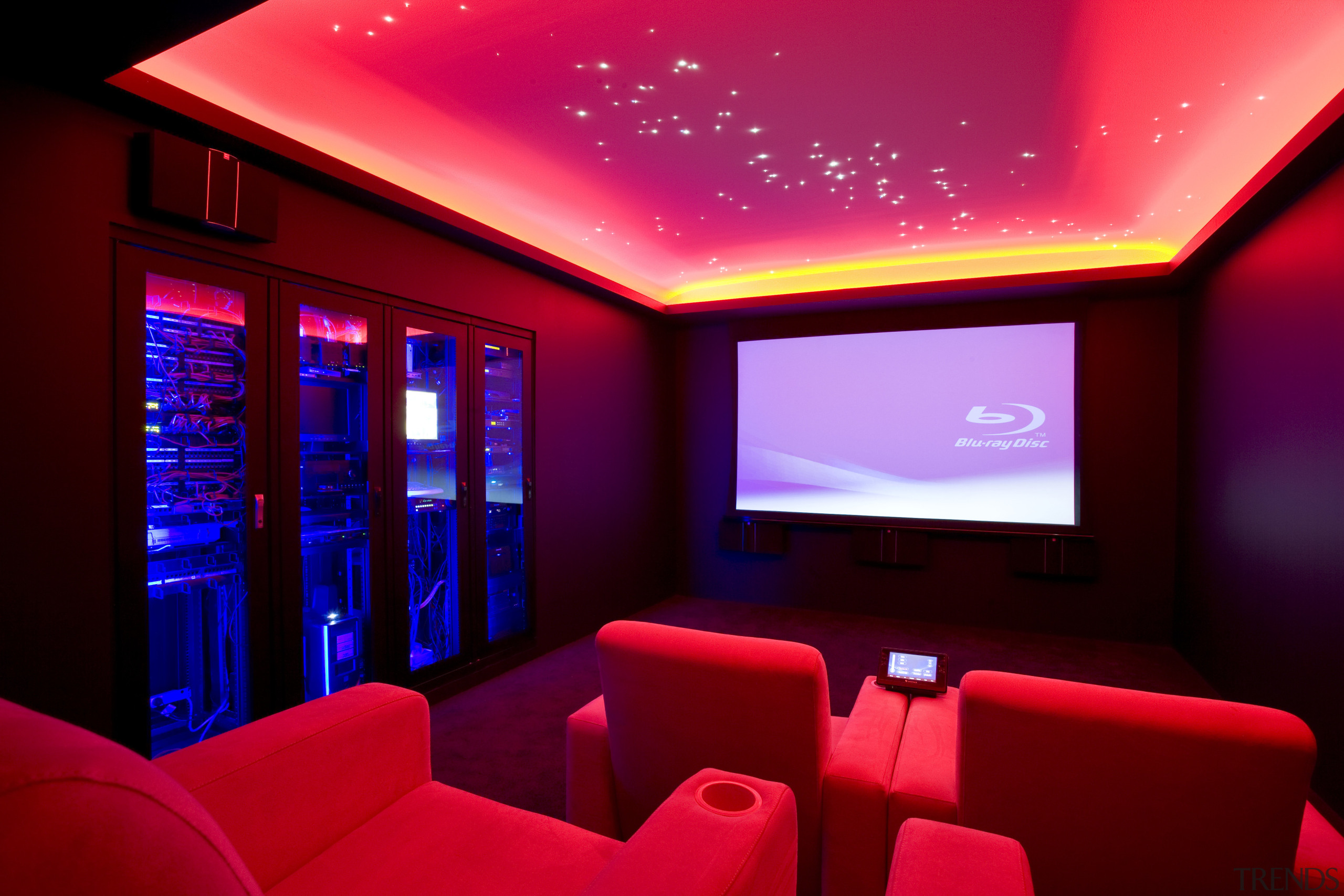 View of home cinema with projector screen, audiovisual entertainment, interior design, lighting, purple, red