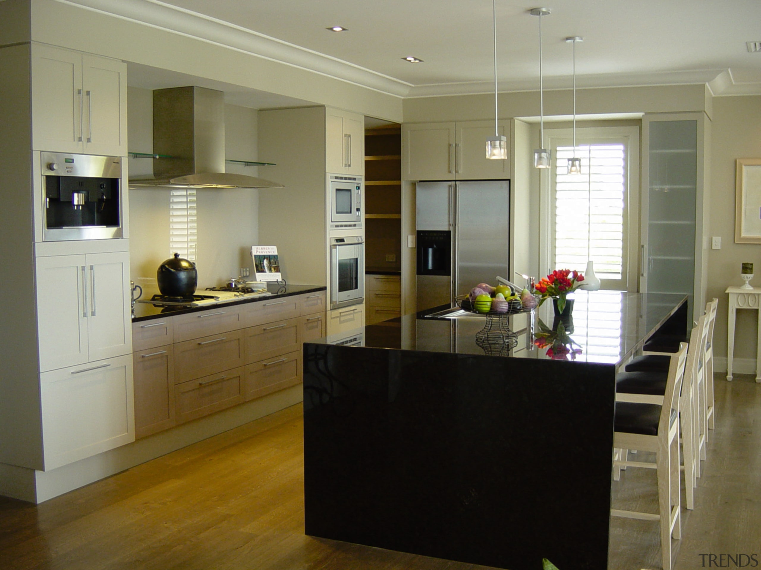 Kitchen with dark granite benchtop and island, bar cabinetry, countertop, cuisine classique, floor, flooring, hardwood, interior design, kitchen, laminate flooring, real estate, room, wood flooring, brown