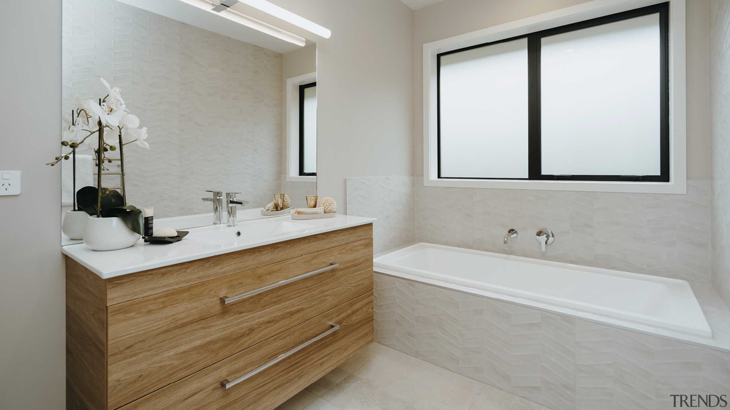 The family bathroom complete with tub, large vanity 