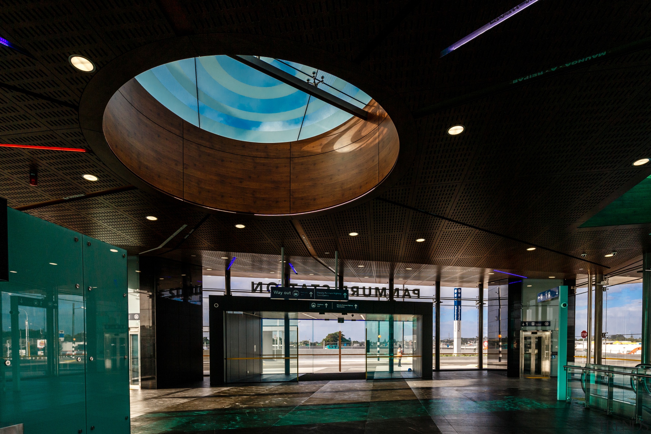 A substantial, timber-clad gullwing roof appears to float architecture, ceiling, daylighting, glass, interior design, lobby, black