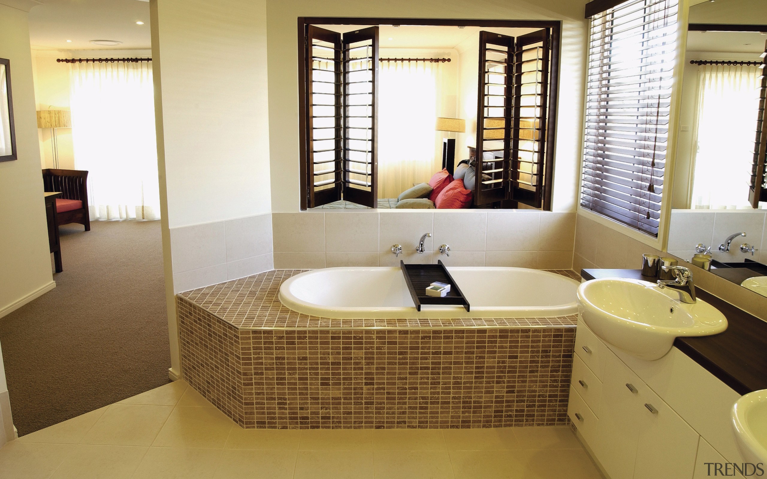 A view of a bathroom, cream tiled floor, bathroom, floor, interior design, real estate, room, suite, brown, white