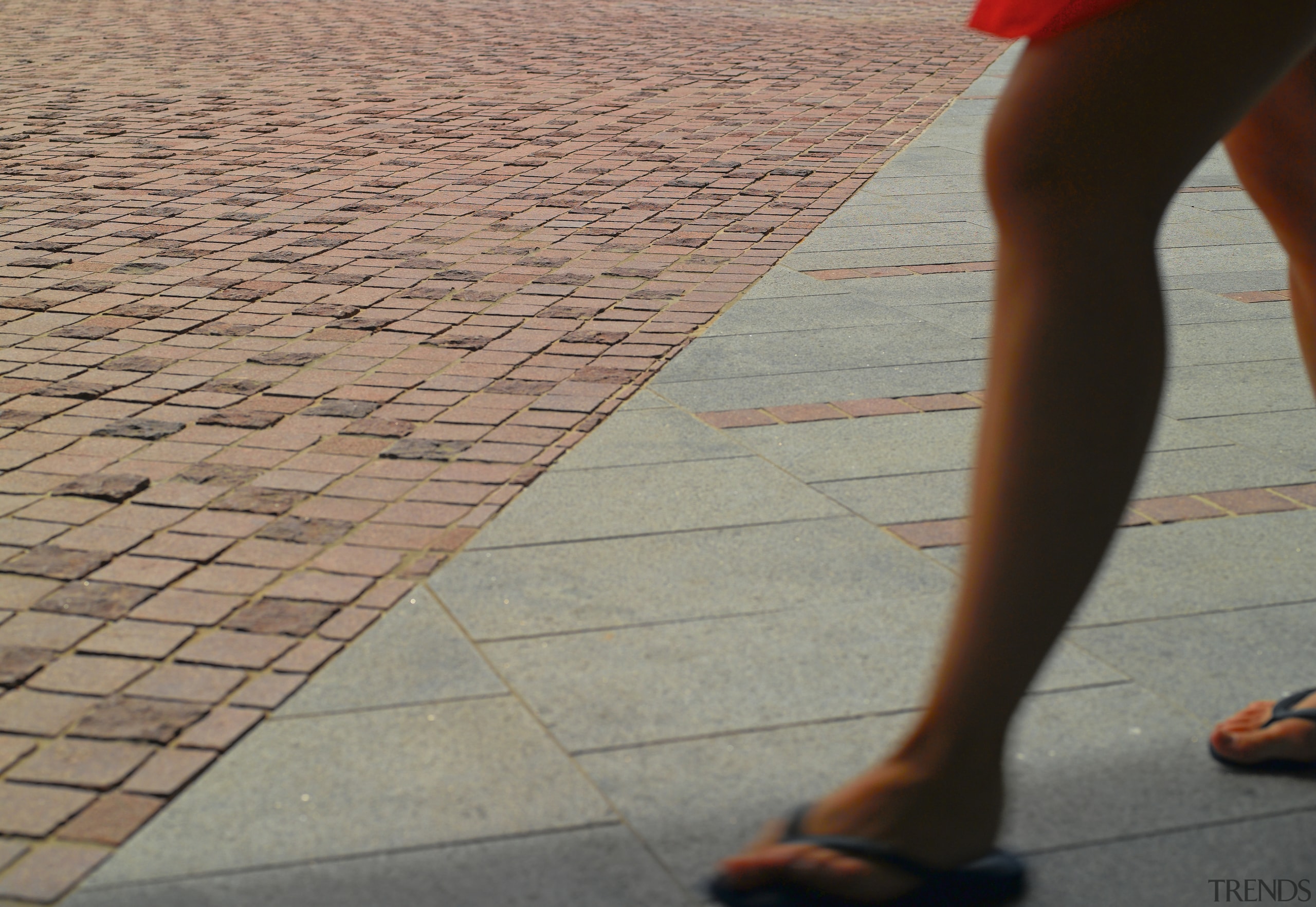 Image featuring paving done by Sam the Paving ankle, barefoot, calf, floor, flooring, foot, footwear, hand, human body, human leg, joint, knee, leg, line, road surface, shadow, shoe, thigh, toe, gray