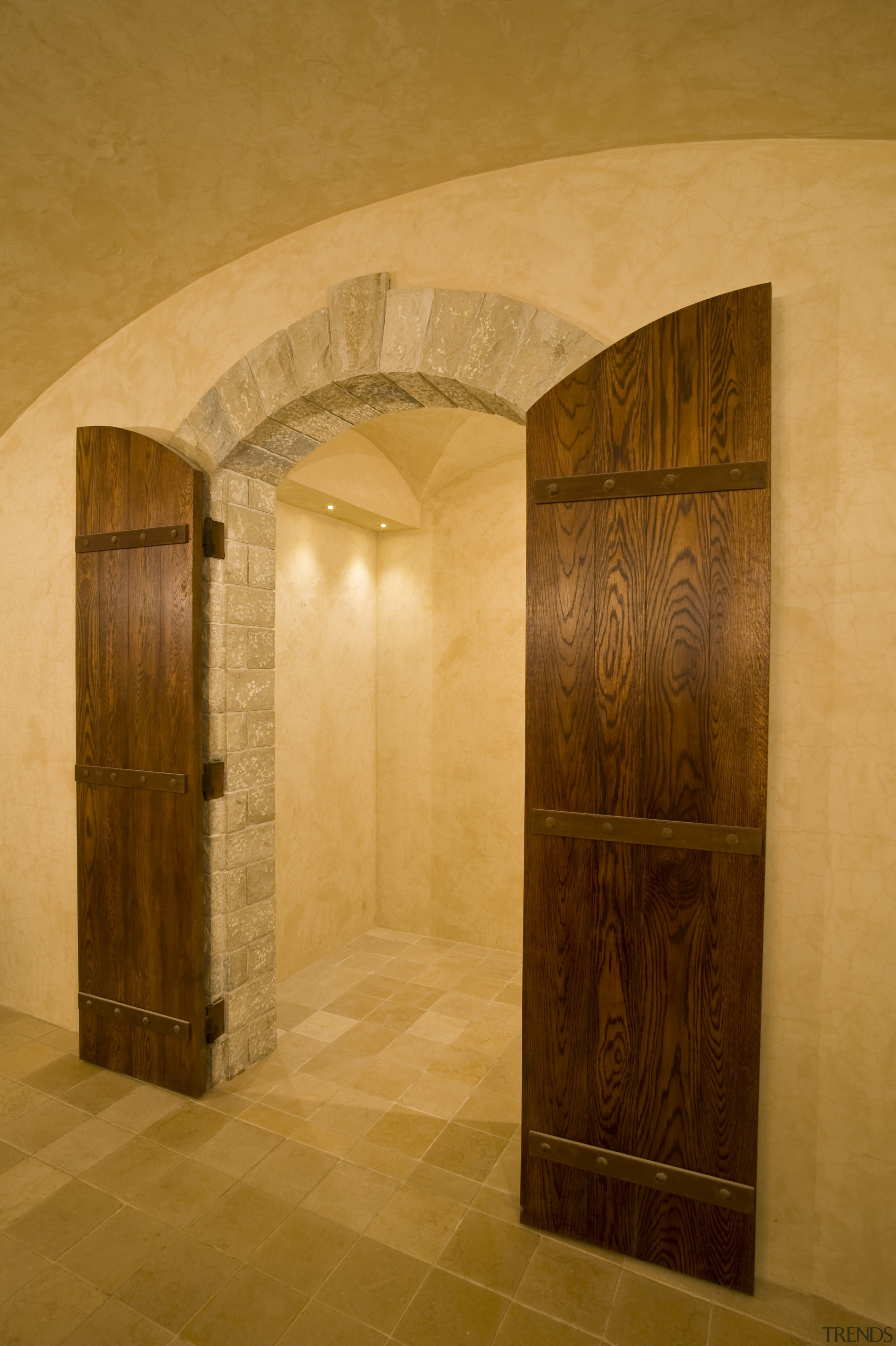 View of a wine cellar which features limestone arch, architecture, ceiling, door, interior design, wall, orange, brown