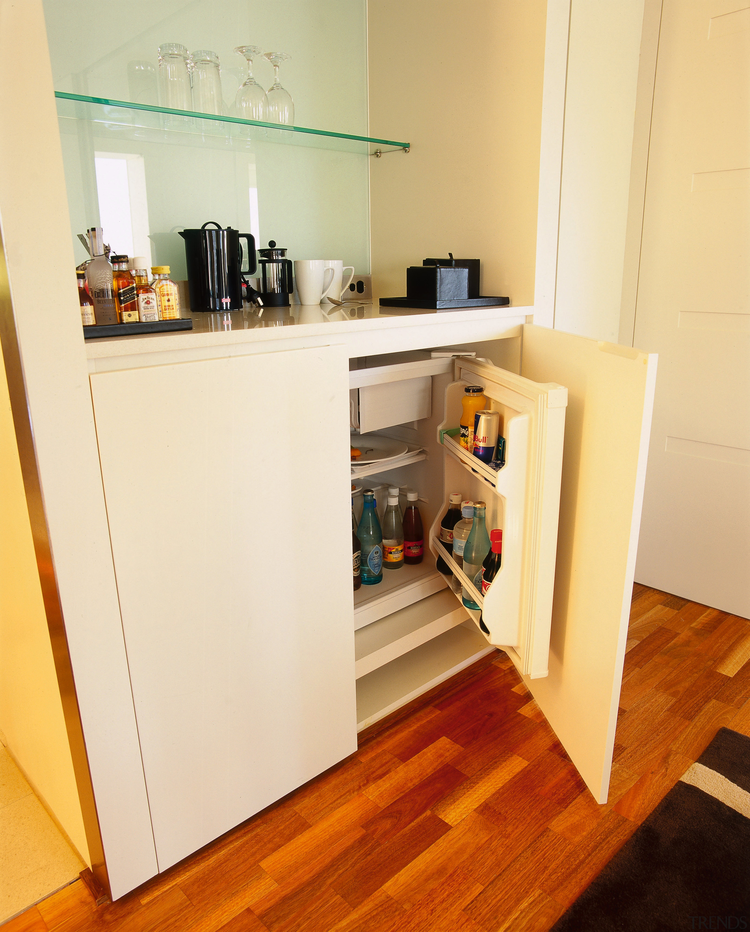 View of hotel mini bar. - View of cabinetry, floor, flooring, furniture, interior design, room, shelf, shelving, orange