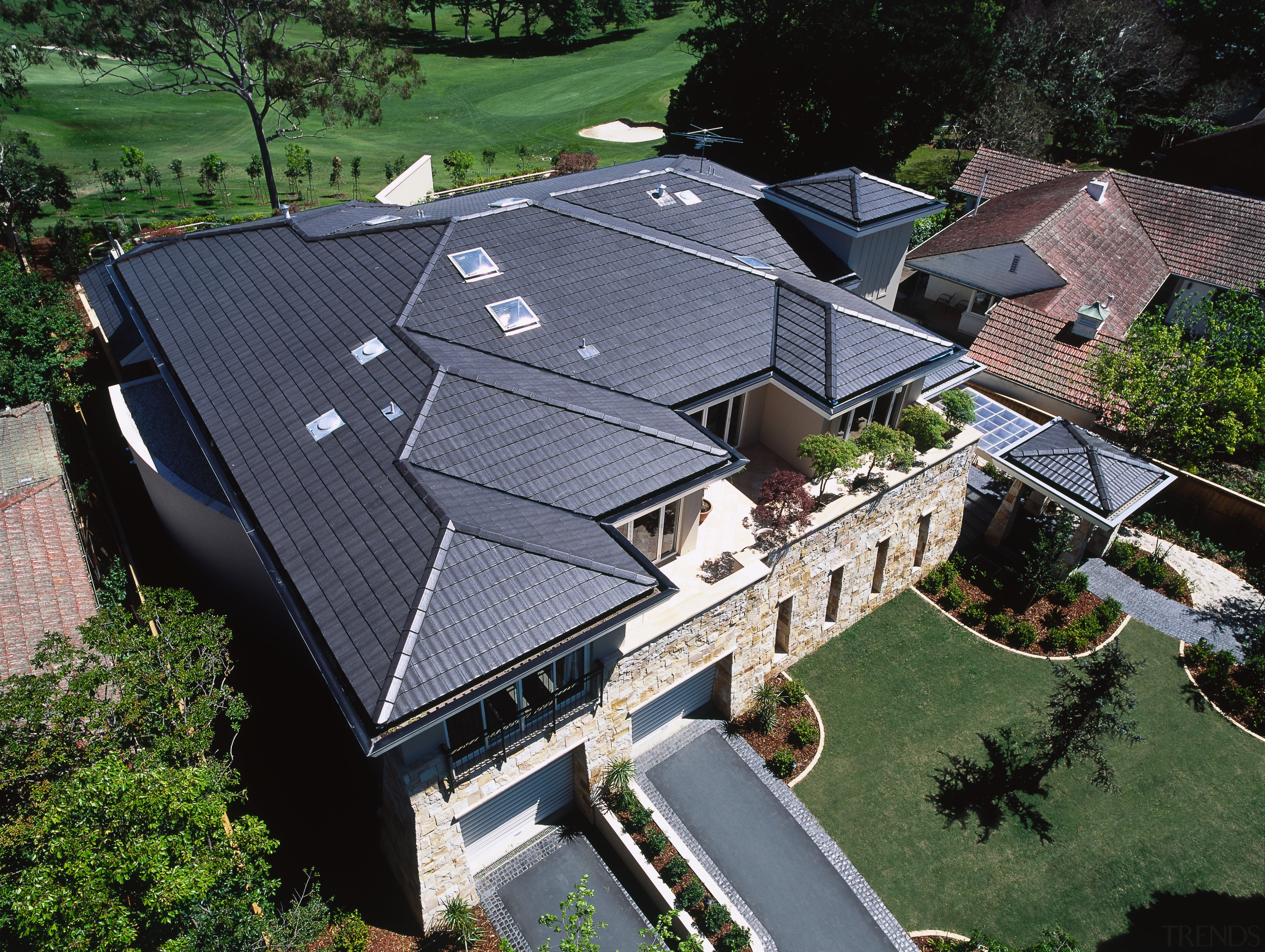 Exterior view looking down at grey concrete tiled aerial photography, architecture, bird's eye view, daylighting, estate, home, house, outdoor structure, property, real estate, residential area, roof, suburb, black
