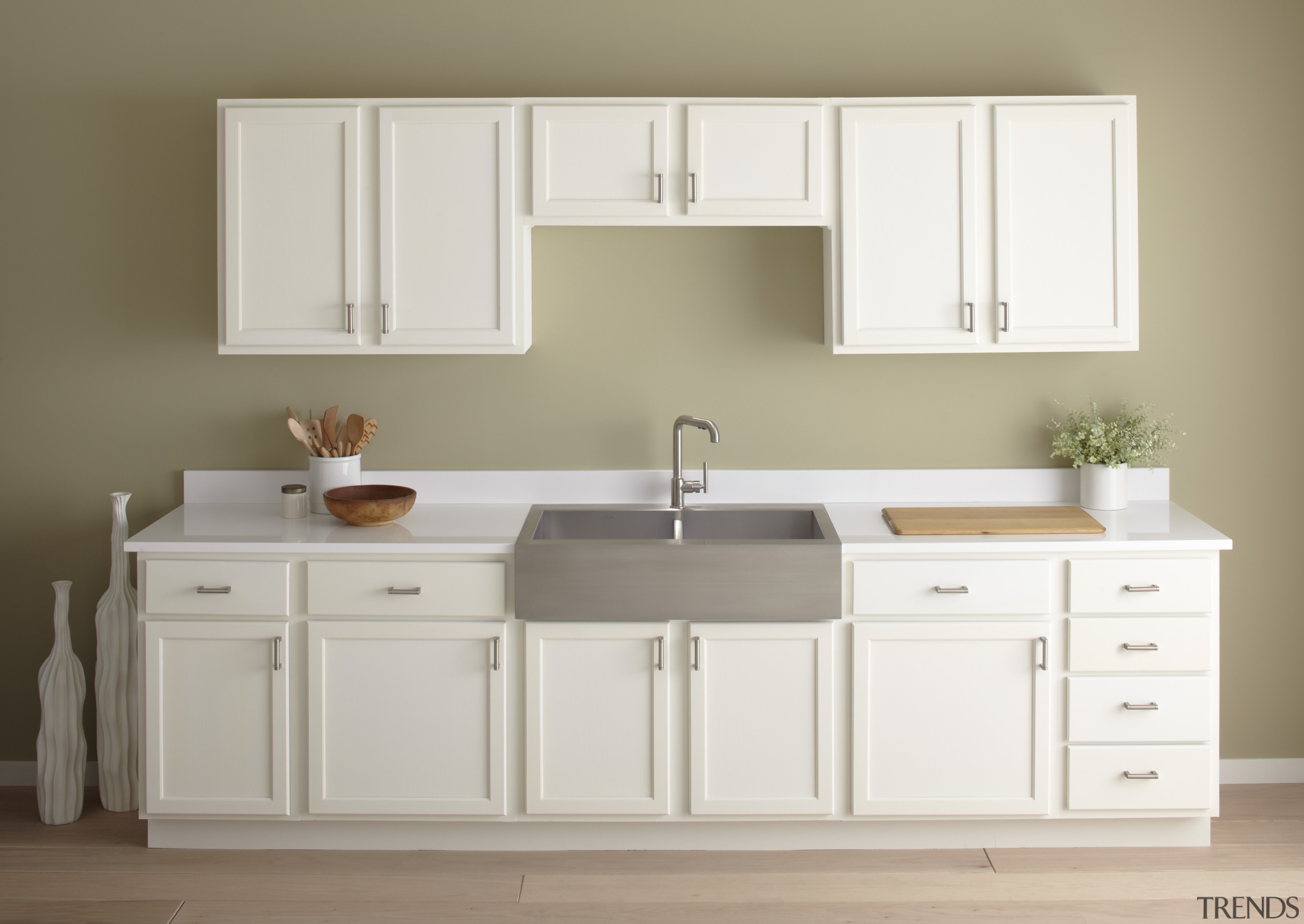 Seen here is a kitchen with a Kohler bathroom, bathroom accessory, bathroom cabinet, bathroom sink, cabinetry, chest of drawers, countertop, cuisine classique, drawer, floor, furniture, hardwood, kitchen, plumbing fixture, product, product design, room, sink, tap, gray