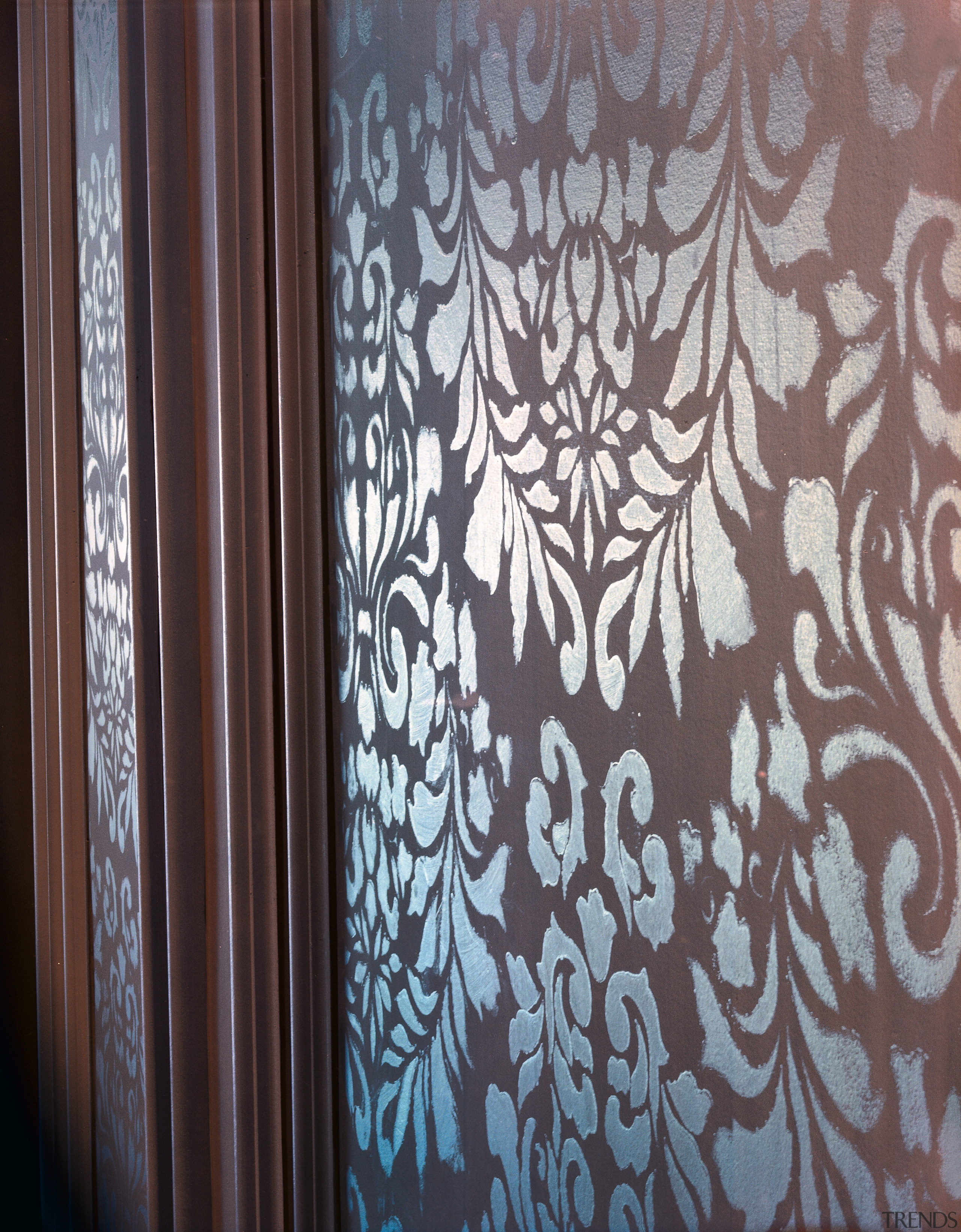 Closeup of stencilling on wall panel. - Closeup curtain, design, interior design, pattern, textile, wall, wallpaper, wood, gray, black