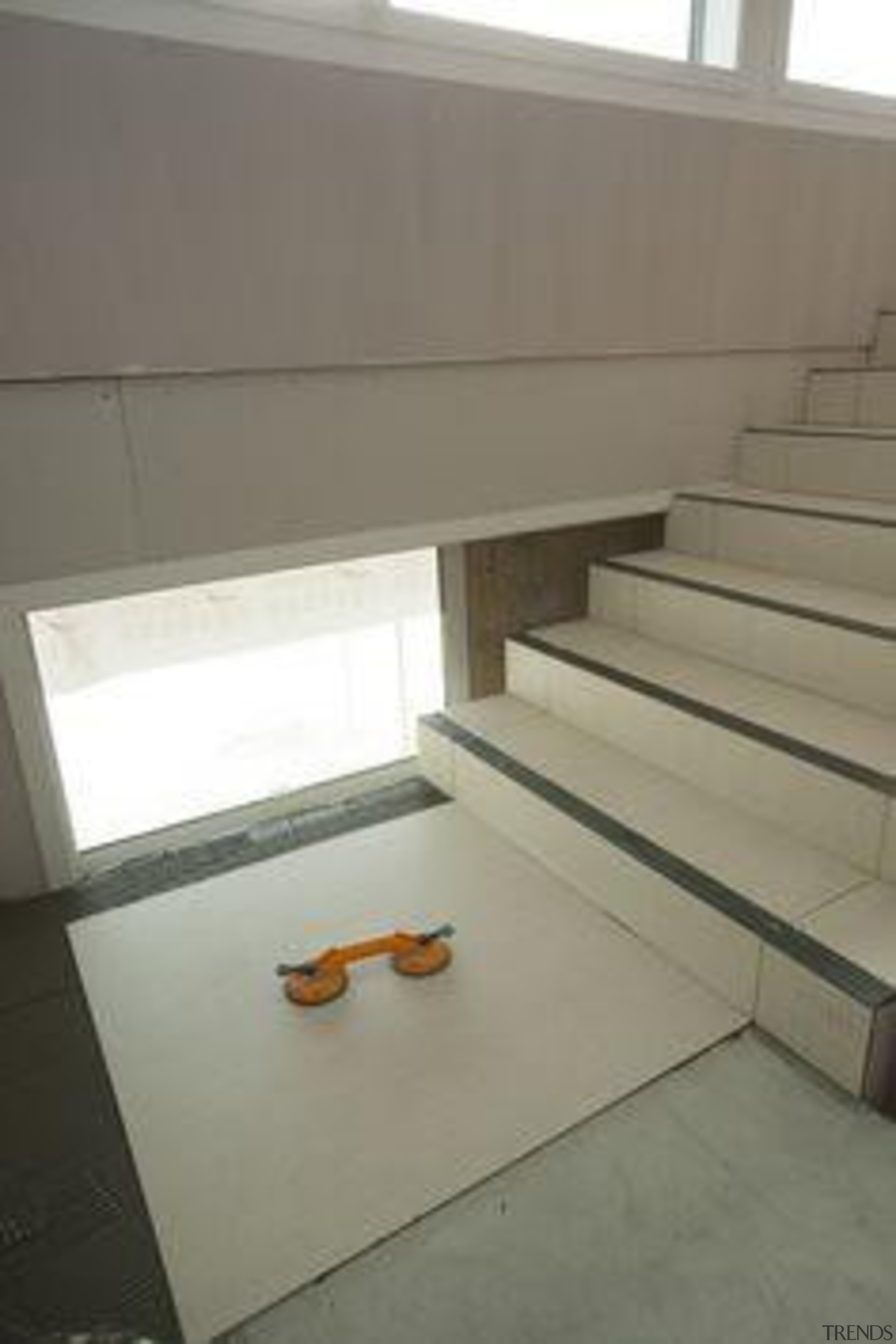 Installation of Naturali travertino avorio on floors. architecture, daylighting, floor, flooring, interior design, product design, property, stairs, table, tile, gray