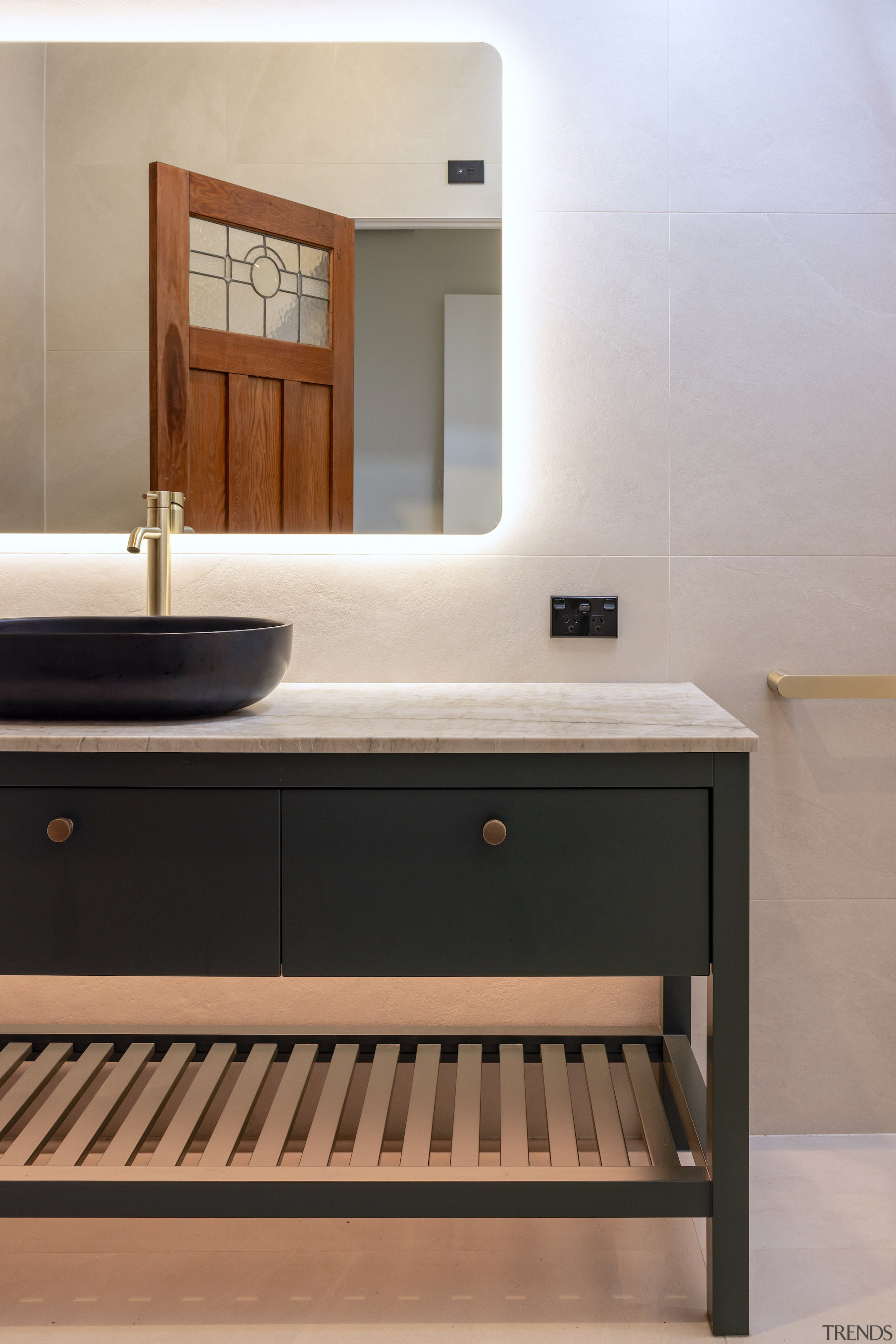 A custom vanity combines open shelving with ample 