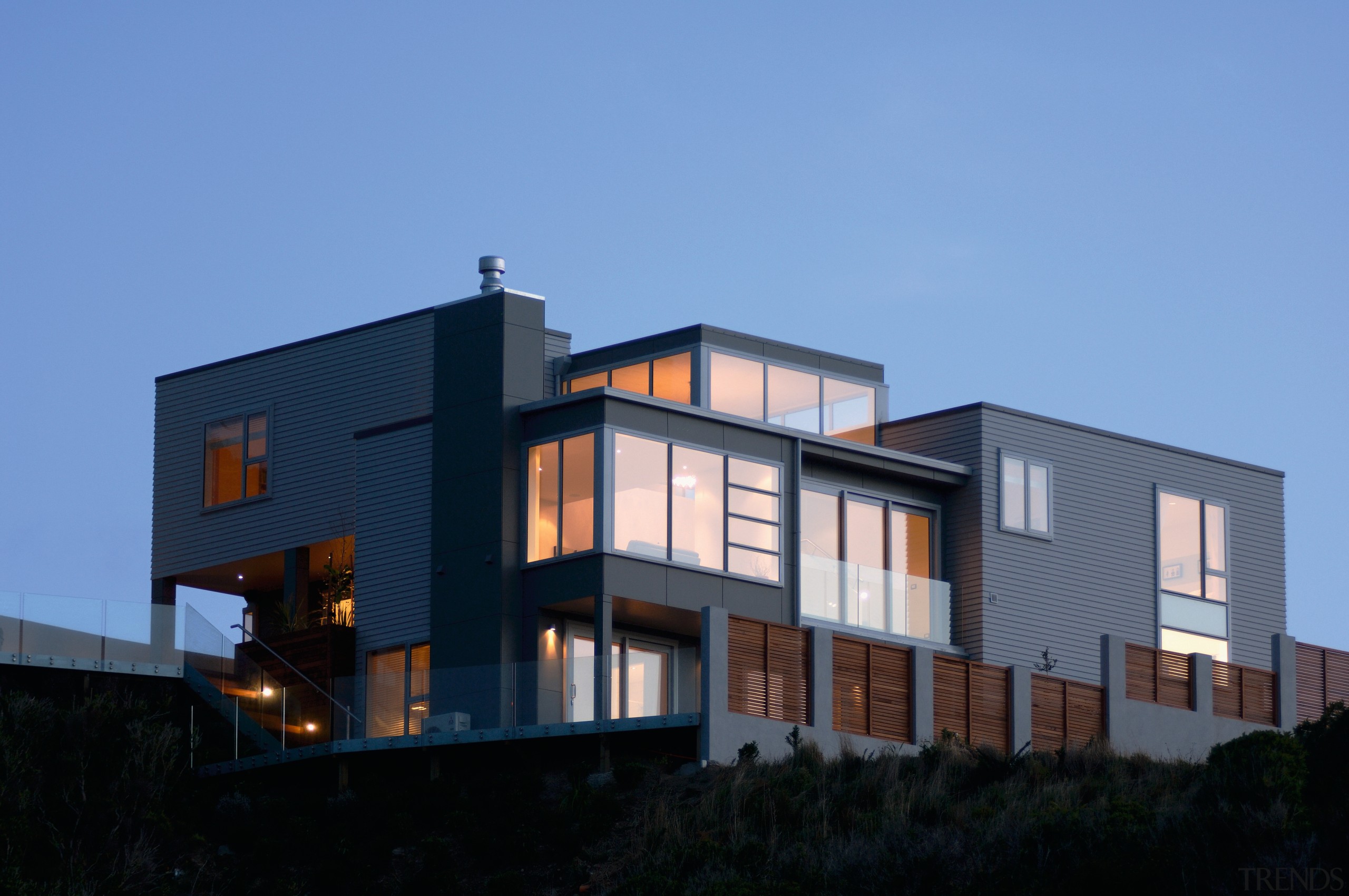 Exterior view of large multi-level home with weatherboard architecture, building, elevation, facade, home, house, property, real estate, residential area, siding, sky, teal, black