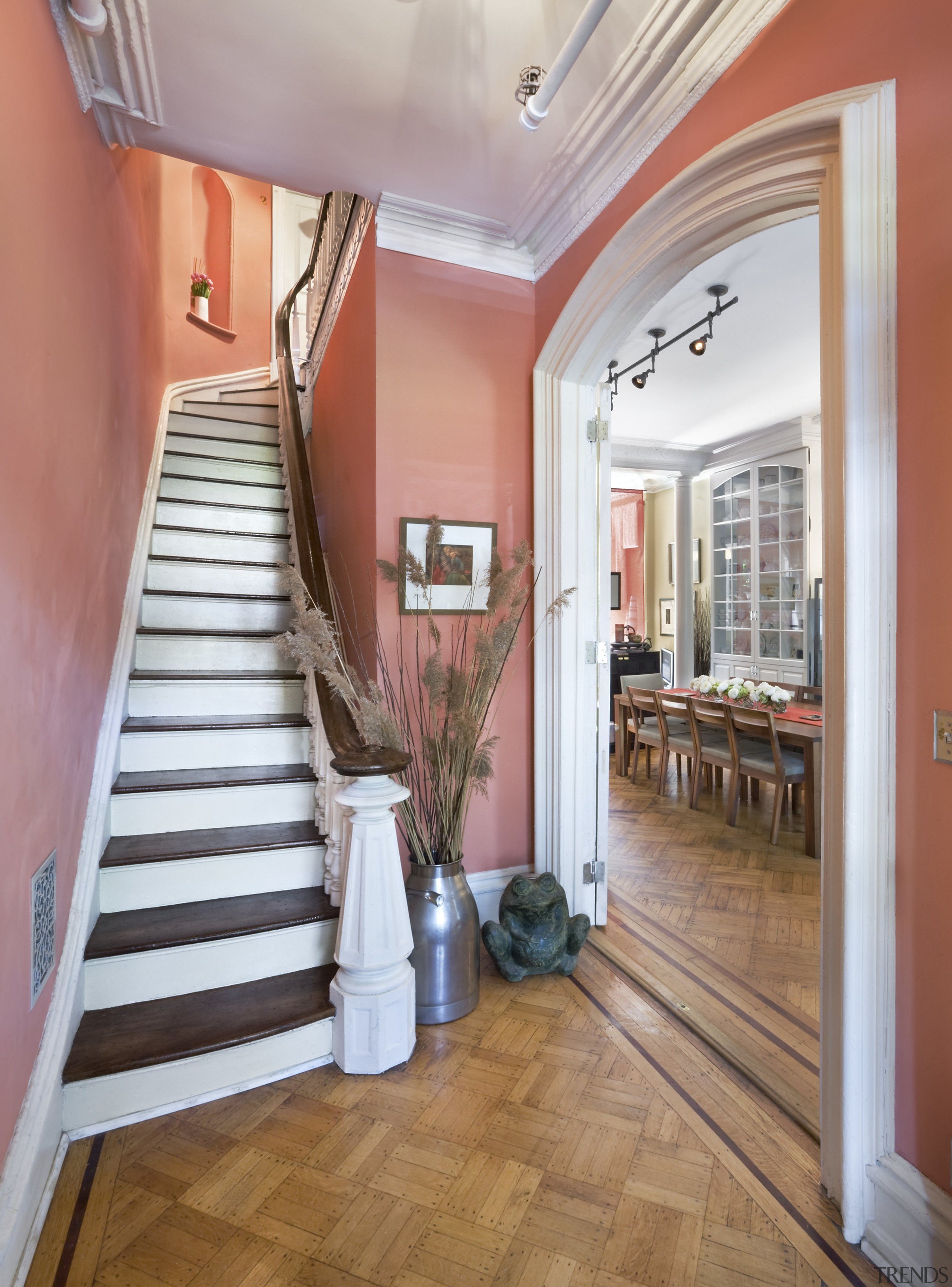 View of a staircase which features timber steps, apartment, ceiling, estate, floor, flooring, handrail, hardwood, home, interior design, property, real estate, stairs, wood, wood flooring, gray, red