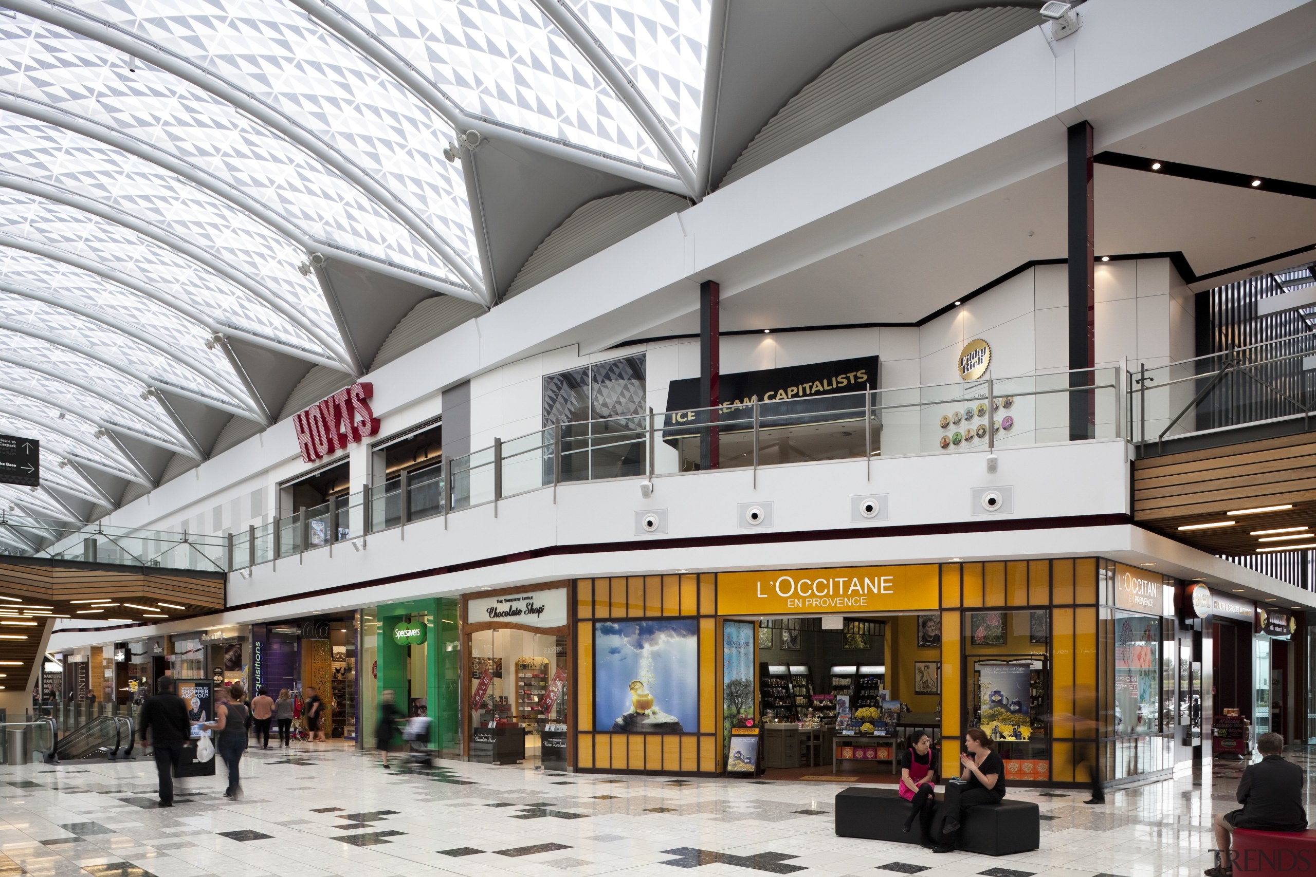 View of interior of mall. - View of building, mixed use, outlet store, retail, shopping mall, white