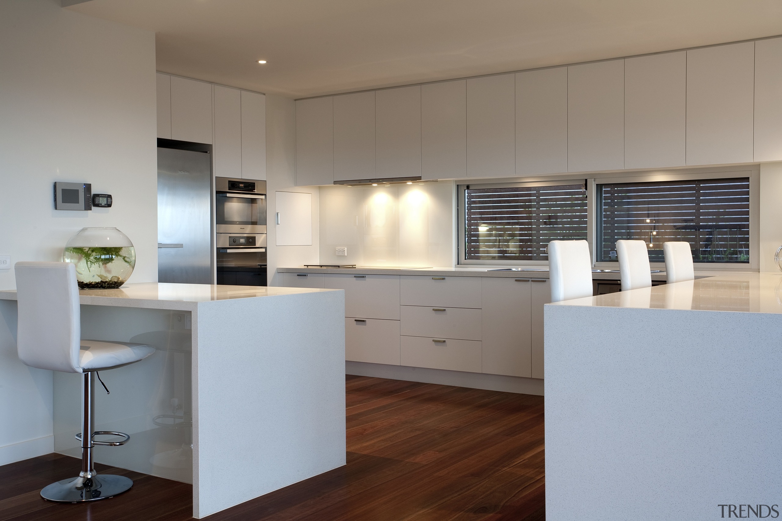 Contemporary kitchen with wooden flooring, white drawers and architecture, cabinetry, countertop, cuisine classique, floor, interior design, kitchen, real estate, gray