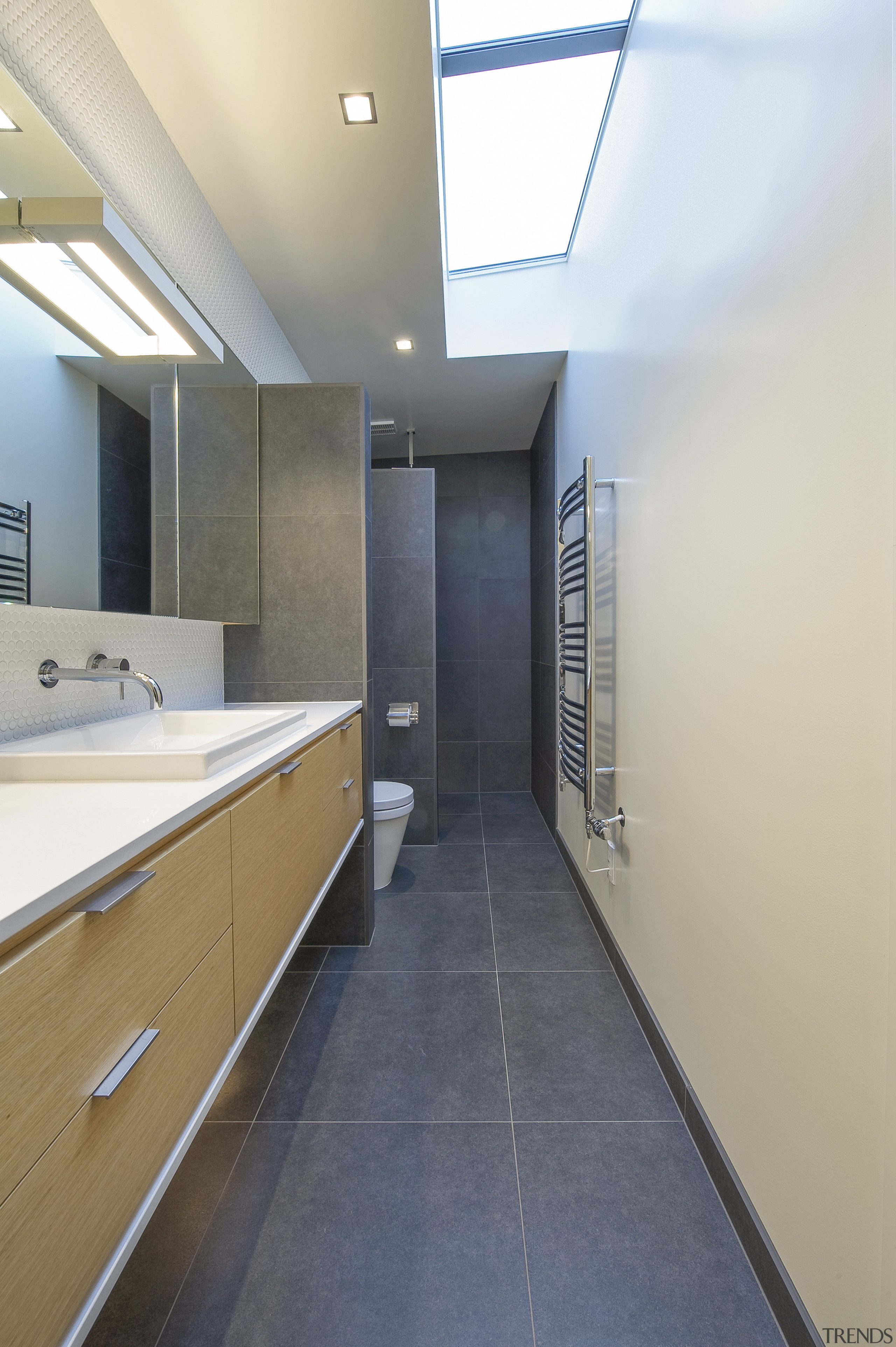 Elongated bathroom with skylights, engineered stone sink by architecture, bathroom, ceiling, countertop, daylighting, floor, flooring, home, house, interior design, real estate, room, tile, white, gray