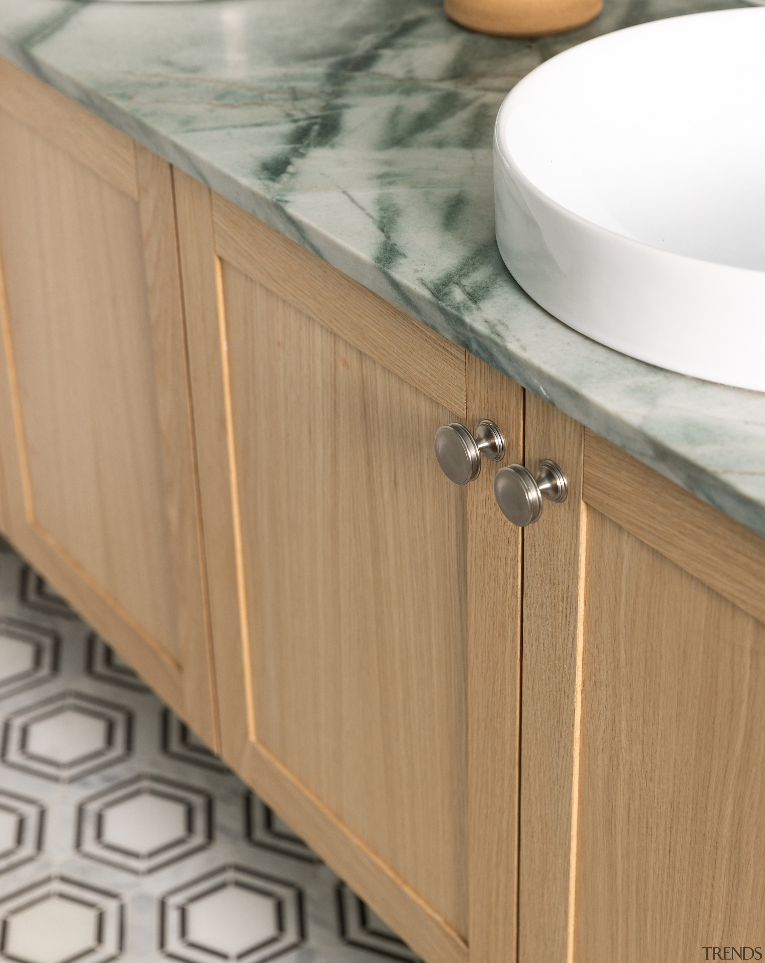 The custom vanity adds the warmth of wood 