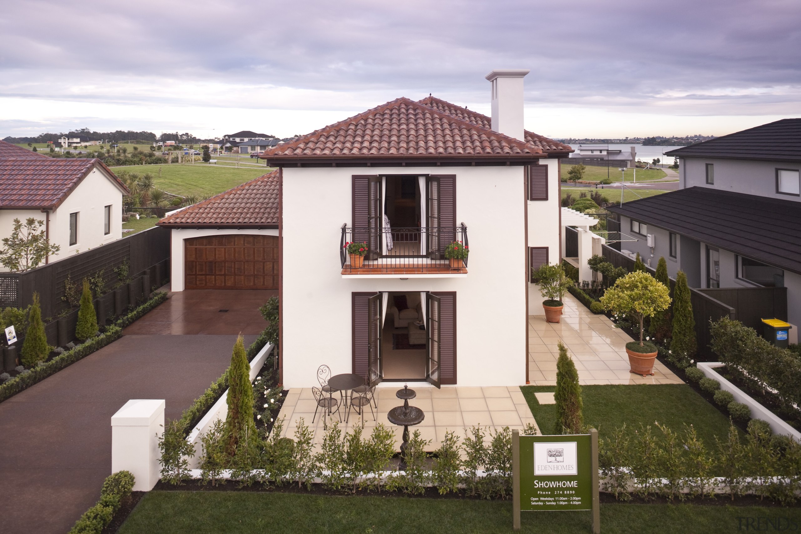 Exterior view of Eden Homes show home which building, cottage, elevation, estate, facade, home, house, property, real estate, residential area, roof, suburb, villa