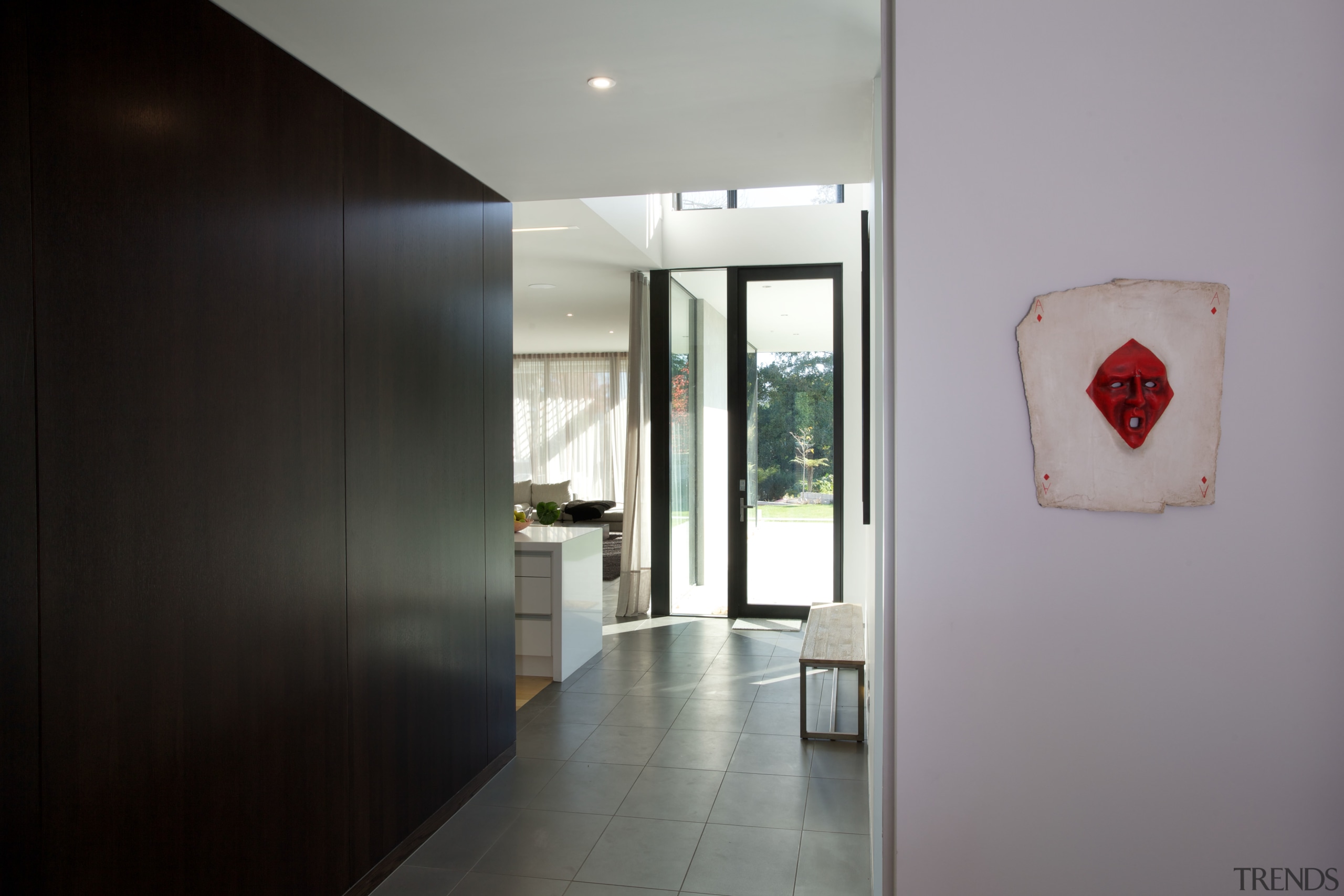 A dark-stained timber wall lines one side of apartment, architecture, ceiling, door, floor, home, house, interior design, real estate, gray, black