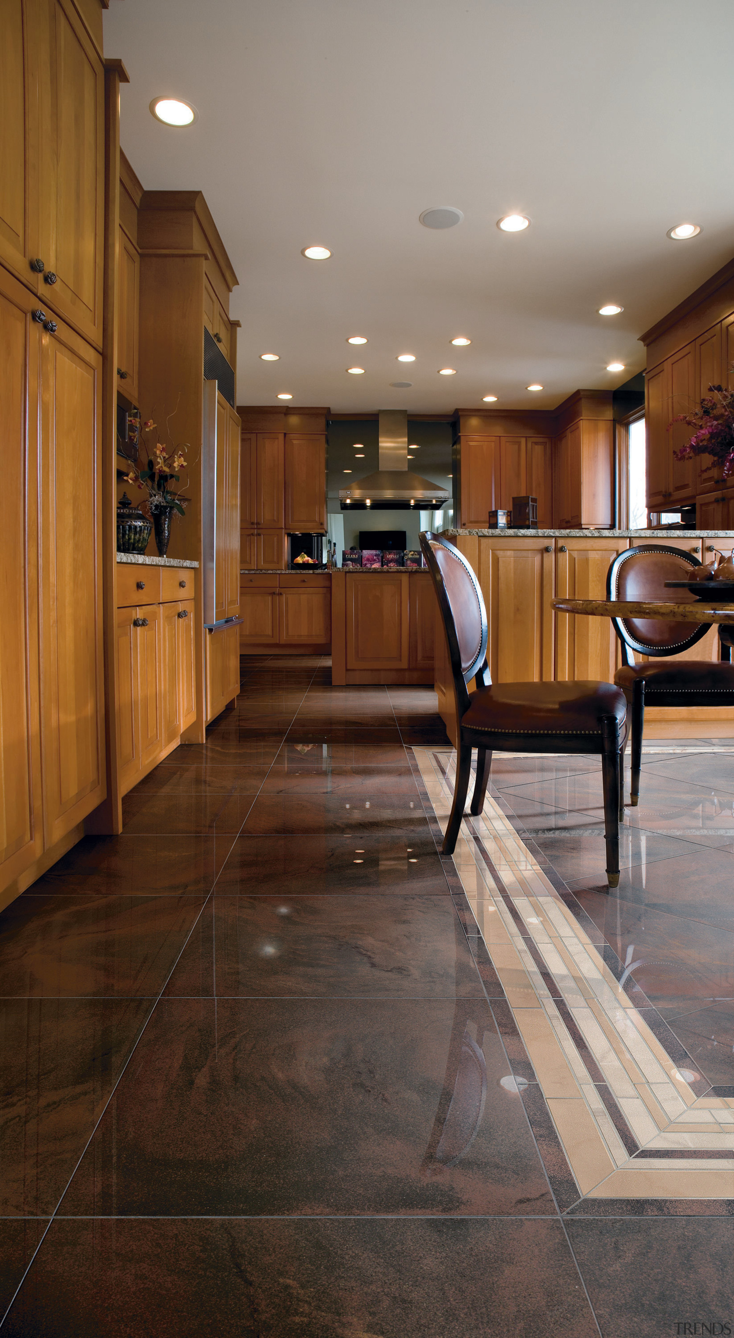 A view of the kitchen an liing areas ceiling, countertop, floor, flooring, hardwood, home, interior design, kitchen, laminate flooring, lighting, lobby, room, tile, wood, wood flooring, brown, gray