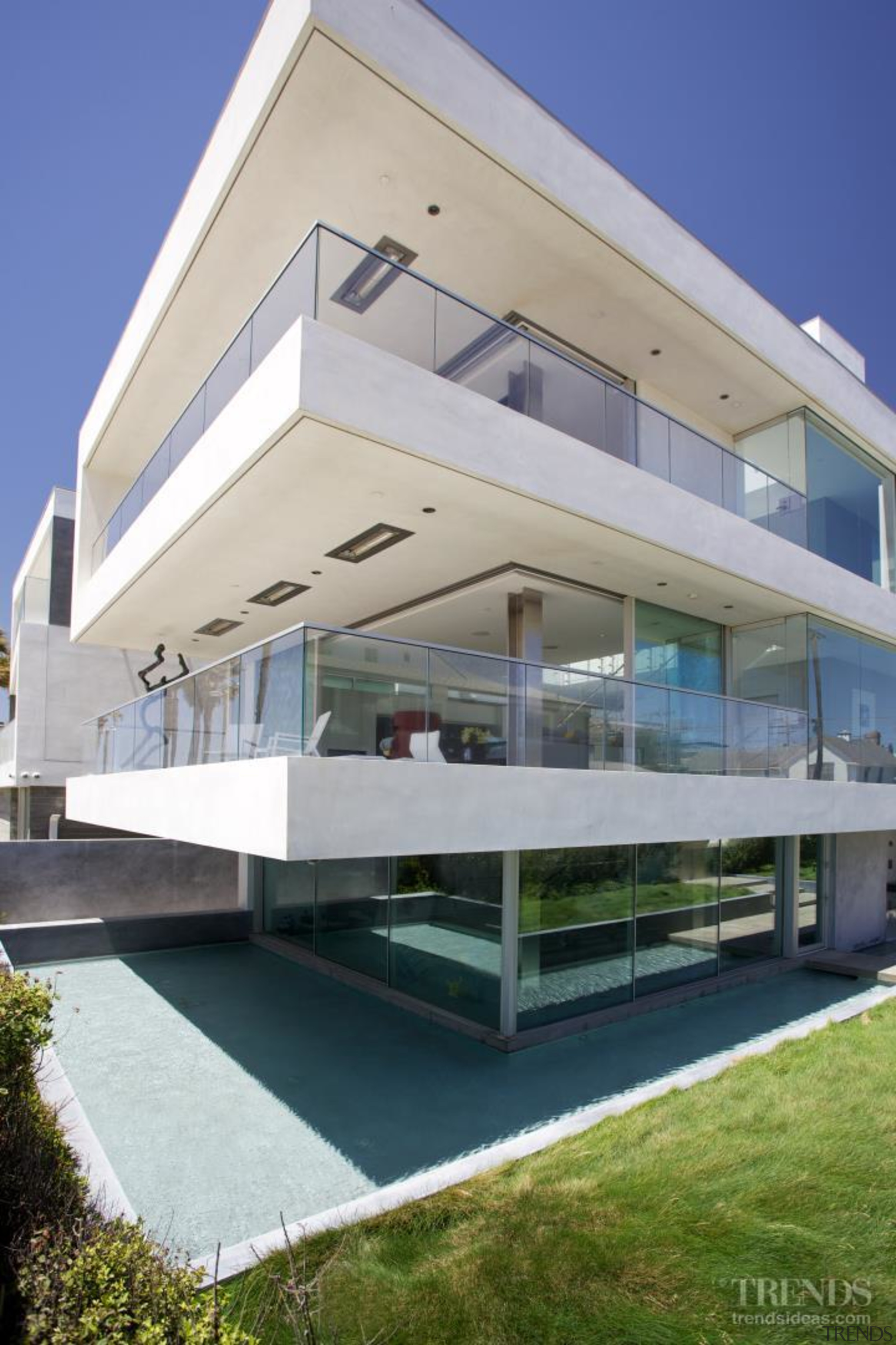 Reflection pools beside this contemporary beachfront house reflect apartment, architecture, building, commercial building, condominium, corporate headquarters, facade, house, mixed use, property, real estate, residential area, villa, gray