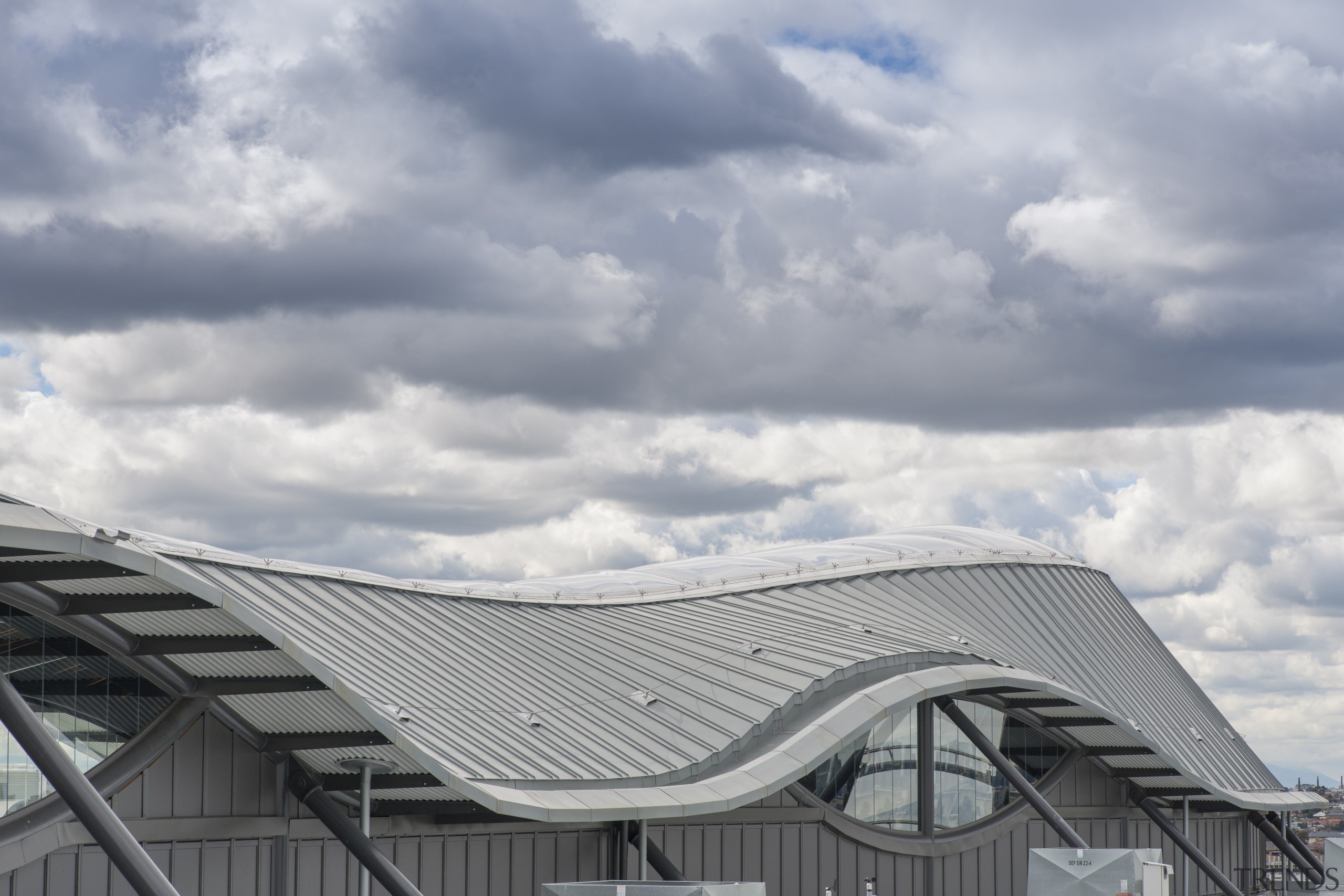 The curvaceous roof is in Rheinzink titanium zinc architecture, building, cloud, daylighting, daytime, facade, house, meteorological phenomenon, outdoor structure, roof, sky, structure, gray