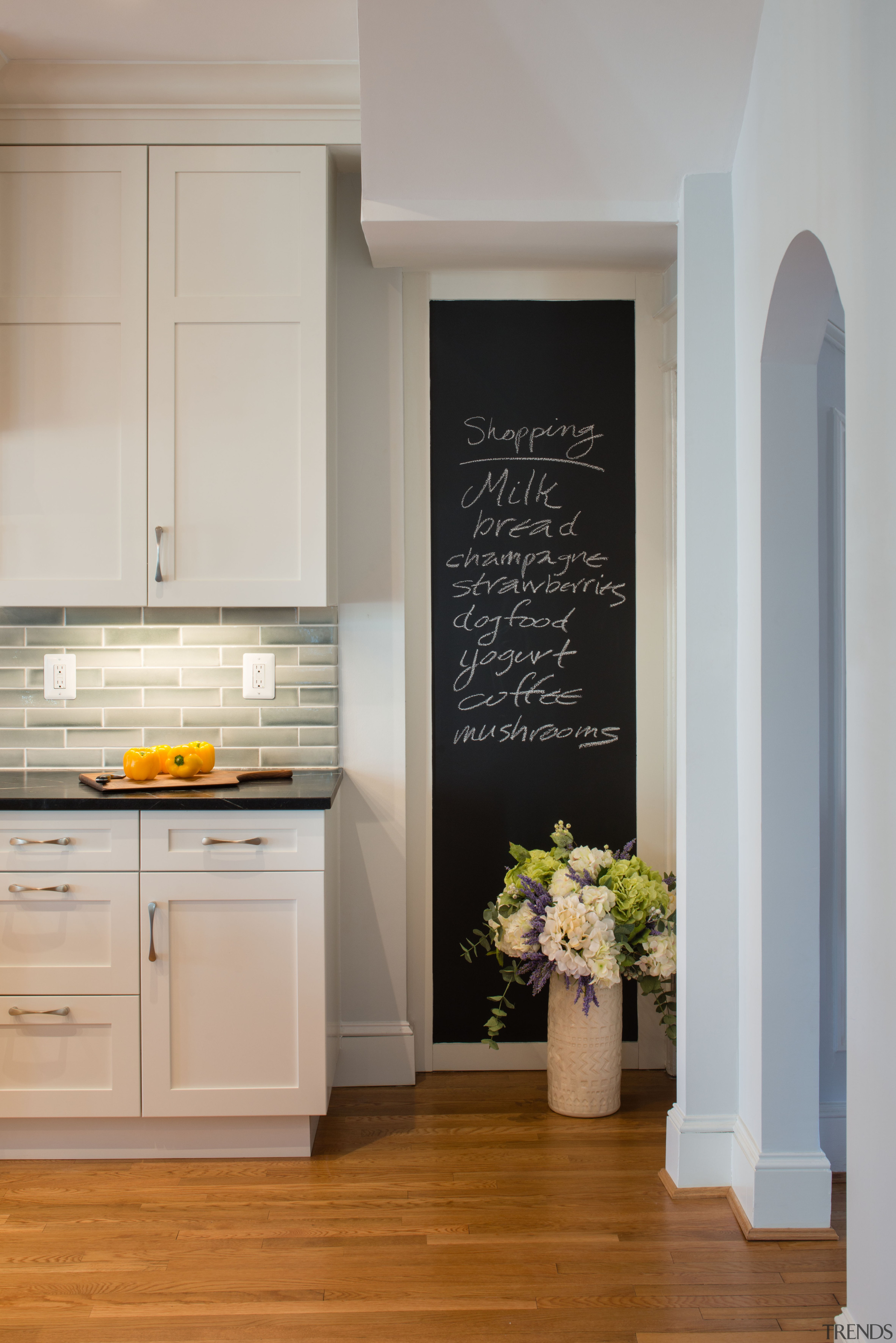 ​​​​​​​Family communication in this kitchen isn’t with a cabinetry, floor, flooring, home, interior design, kitchen