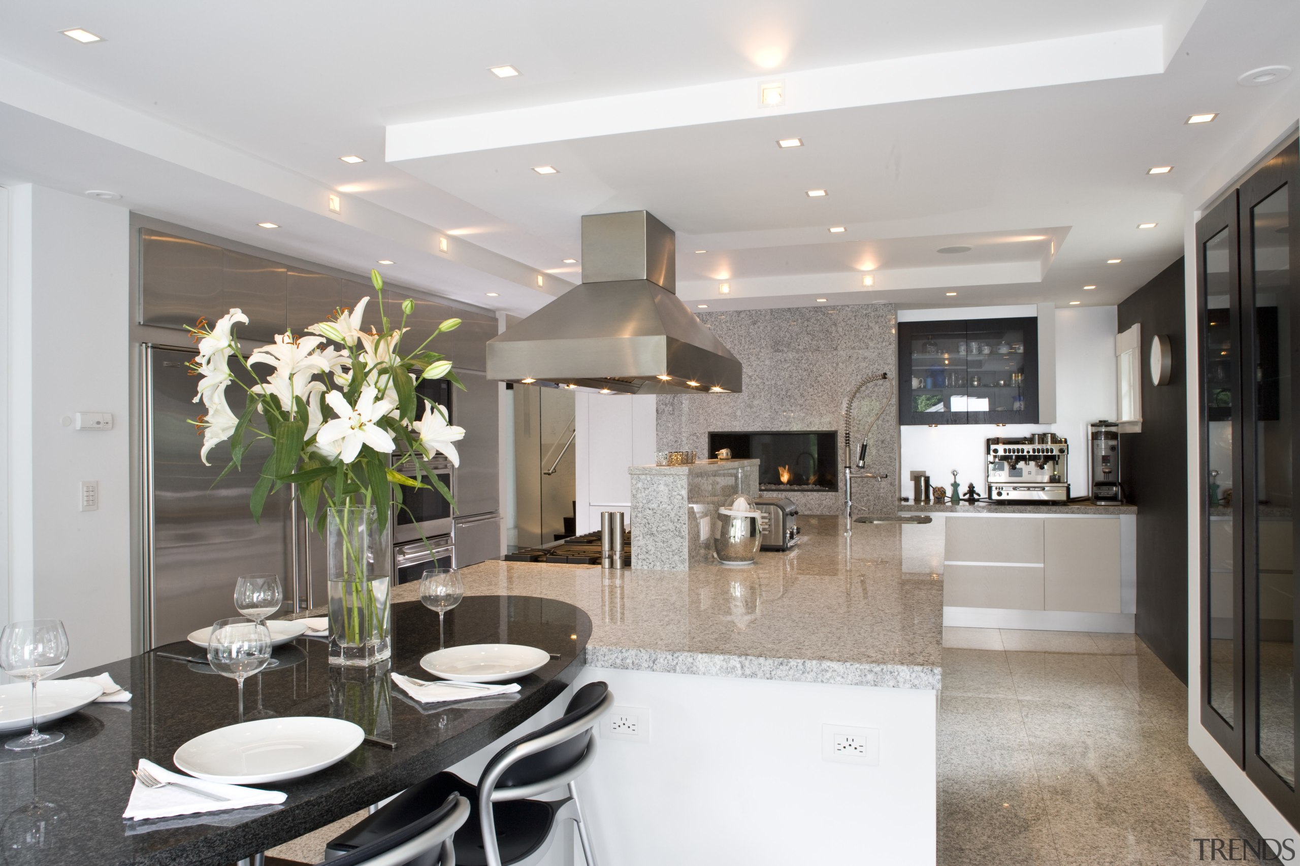 Kitchen has Granite tops and contrasting dark walnut ceiling, countertop, home, interior design, kitchen, living room, real estate, room, gray