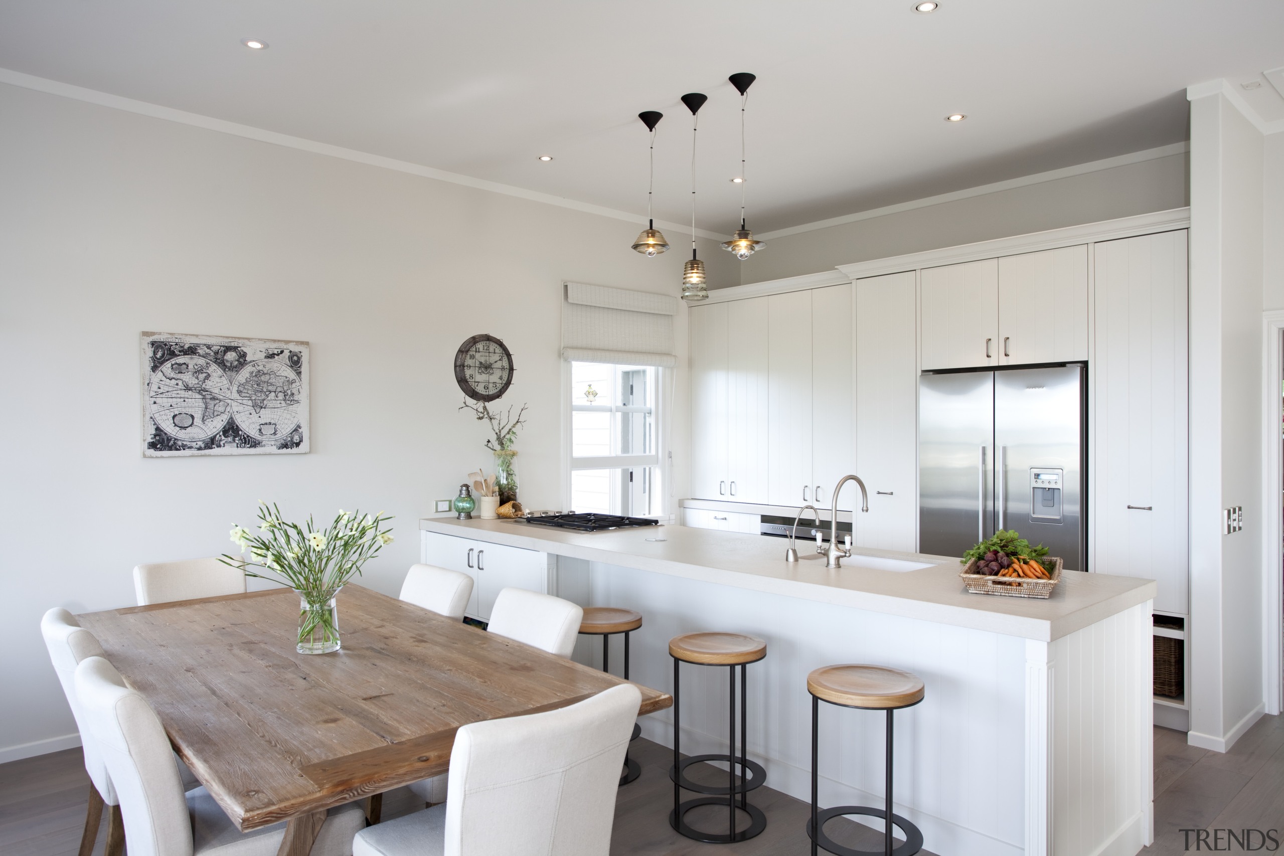 A view of the kitchen and dining areas. countertop, home, interior design, kitchen, property, real estate, room, gray, white