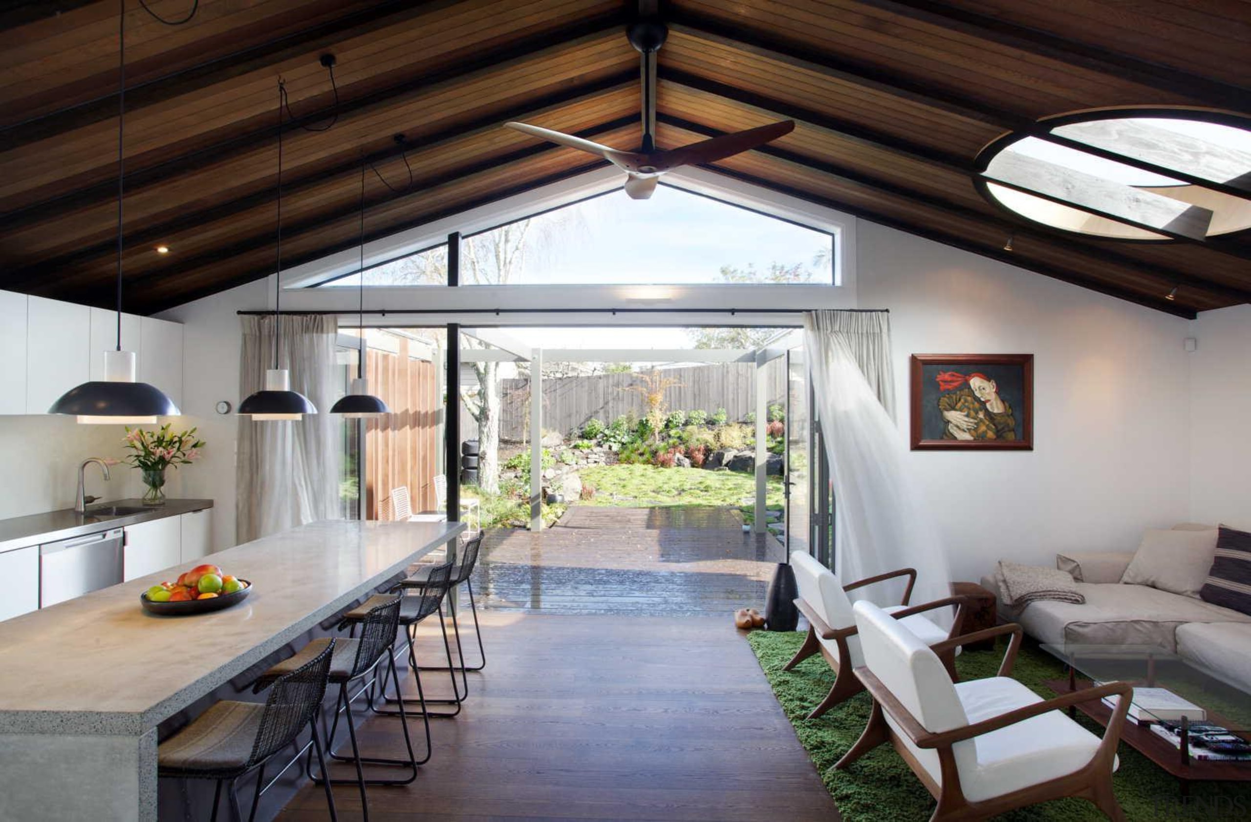 The villa’s deck offers an additional exterior living ceiling, daylighting, house, interior design, real estate, roof, window, gray, black