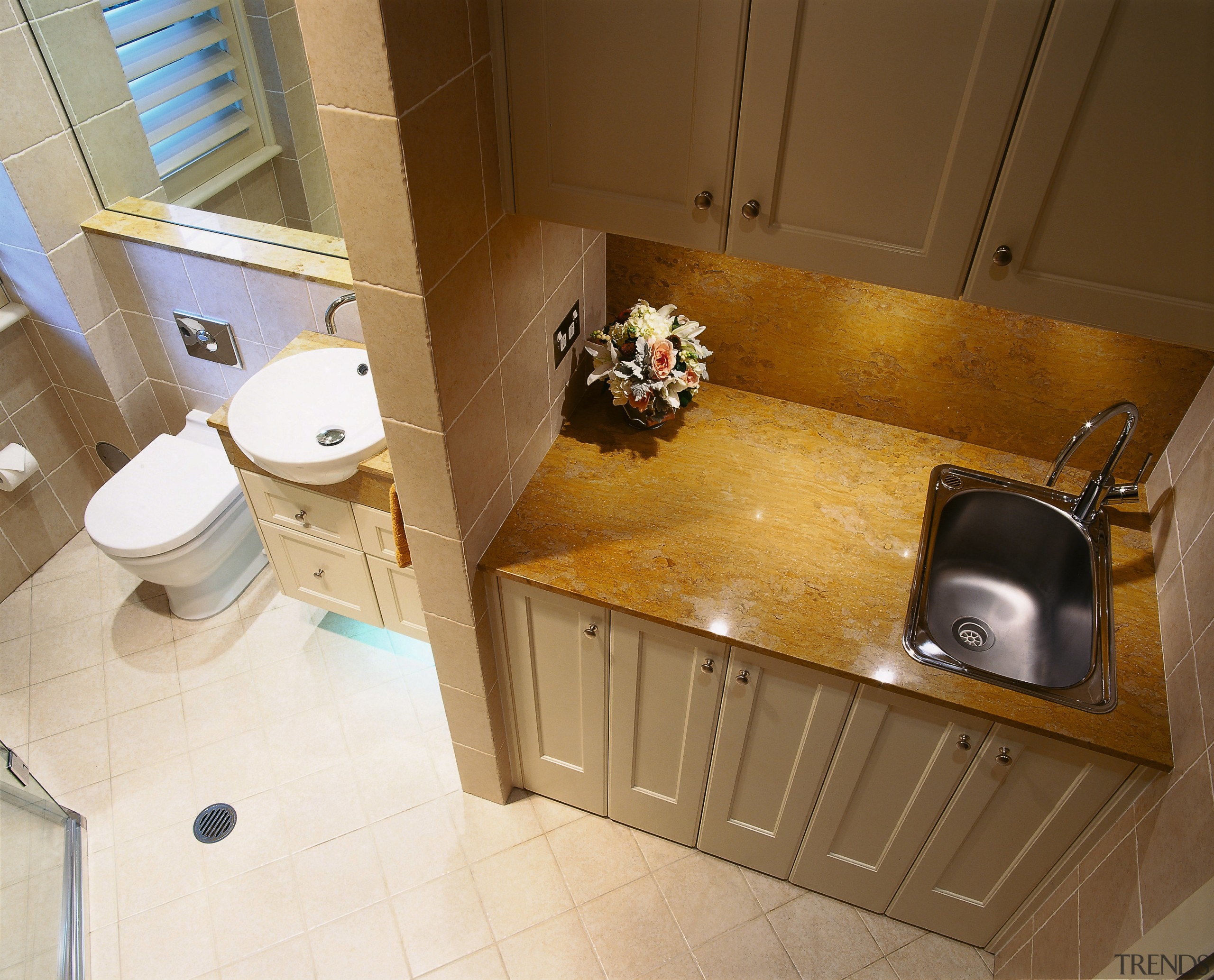 The downward view of a combined bathroom and bathroom, countertop, floor, flooring, home, interior design, kitchen, plumbing fixture, room, sink, tile, wood, brown