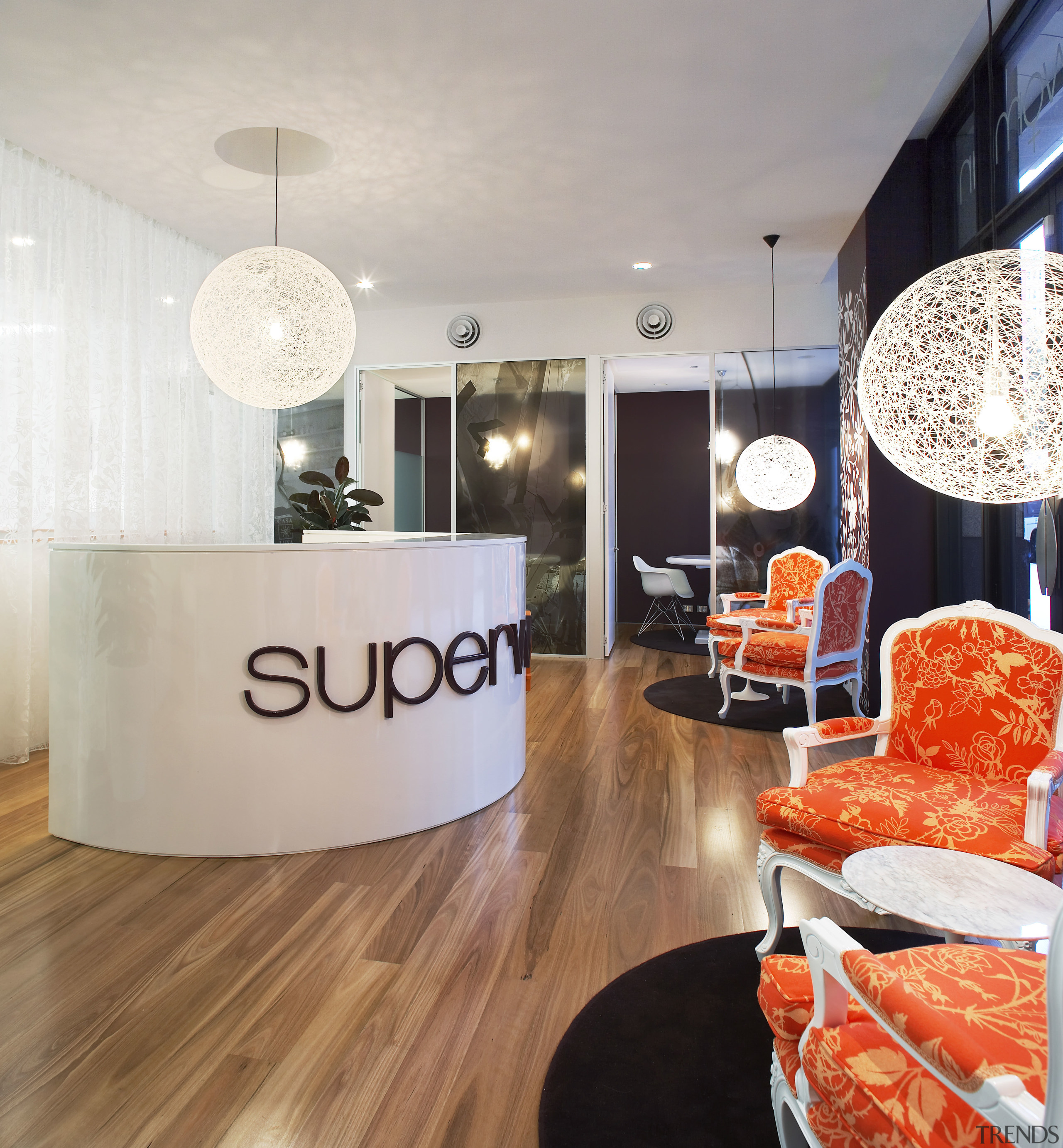 view of the reception area of the SuperWoman ceiling, floor, flooring, interior design, living room, table, gray