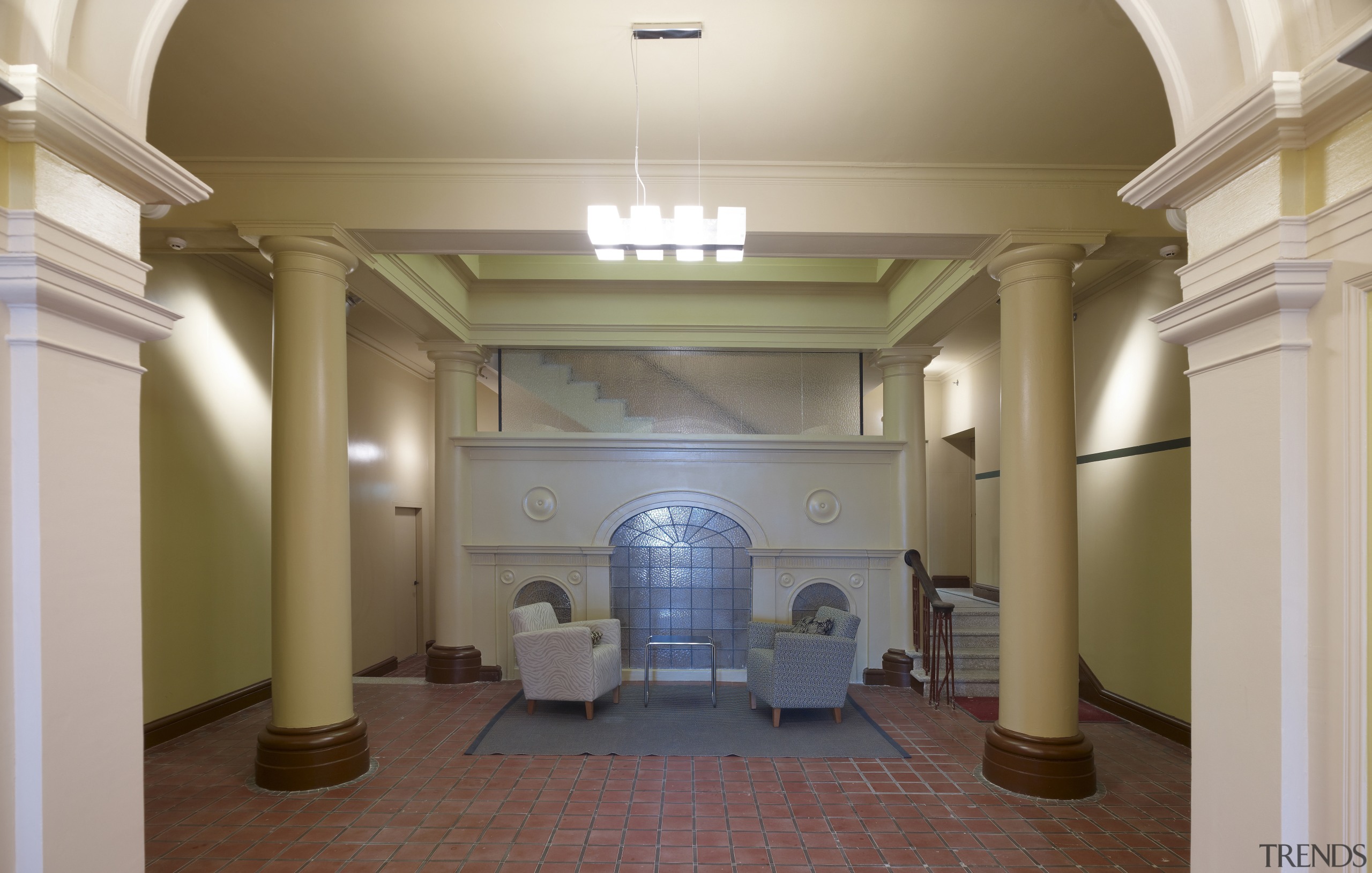 View of lobby in restored historic apartment building. architecture, ceiling, column, estate, home, interior design, lobby, molding, property, real estate, structure, gray, brown